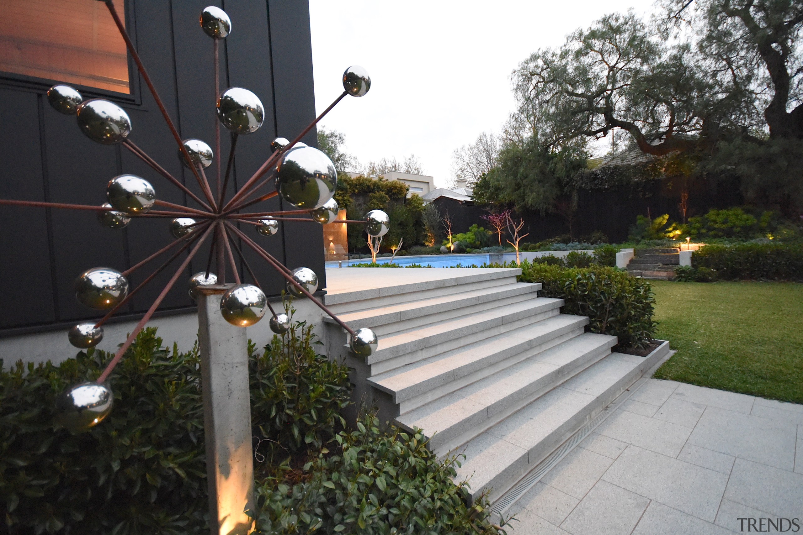 A garden sculpture next to the new pool 