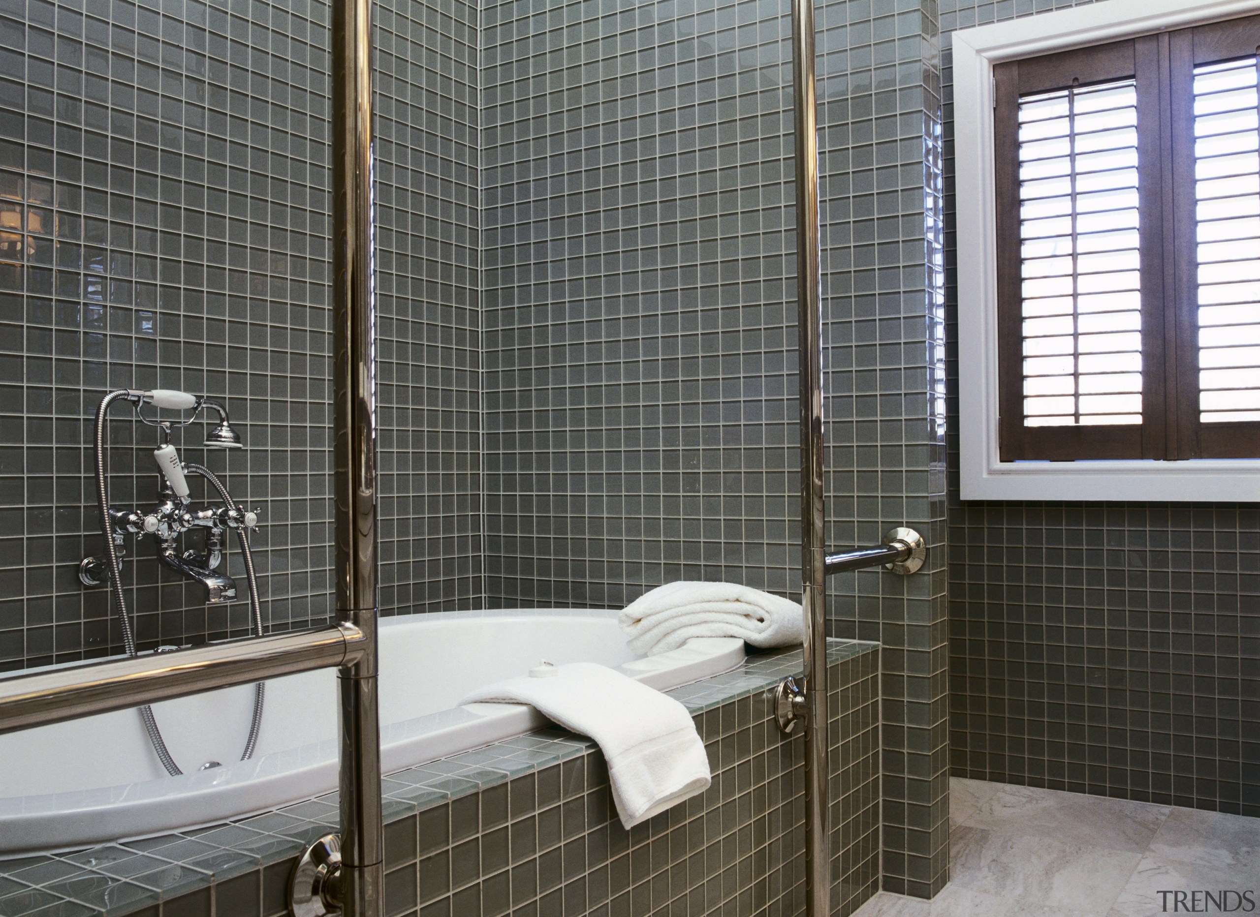 View of bath with glass wall tiles, chrome bathroom, floor, interior design, plumbing fixture, room, tile, wall, window, window covering, window treatment, black, gray