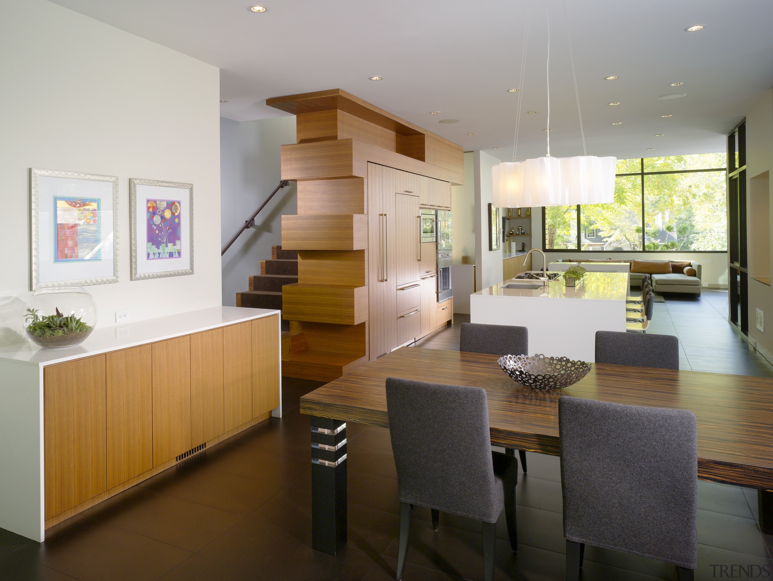 View of dining area with wooden table and dining room, furniture, house, interior design, kitchen, living room, real estate, room, table, gray, brown