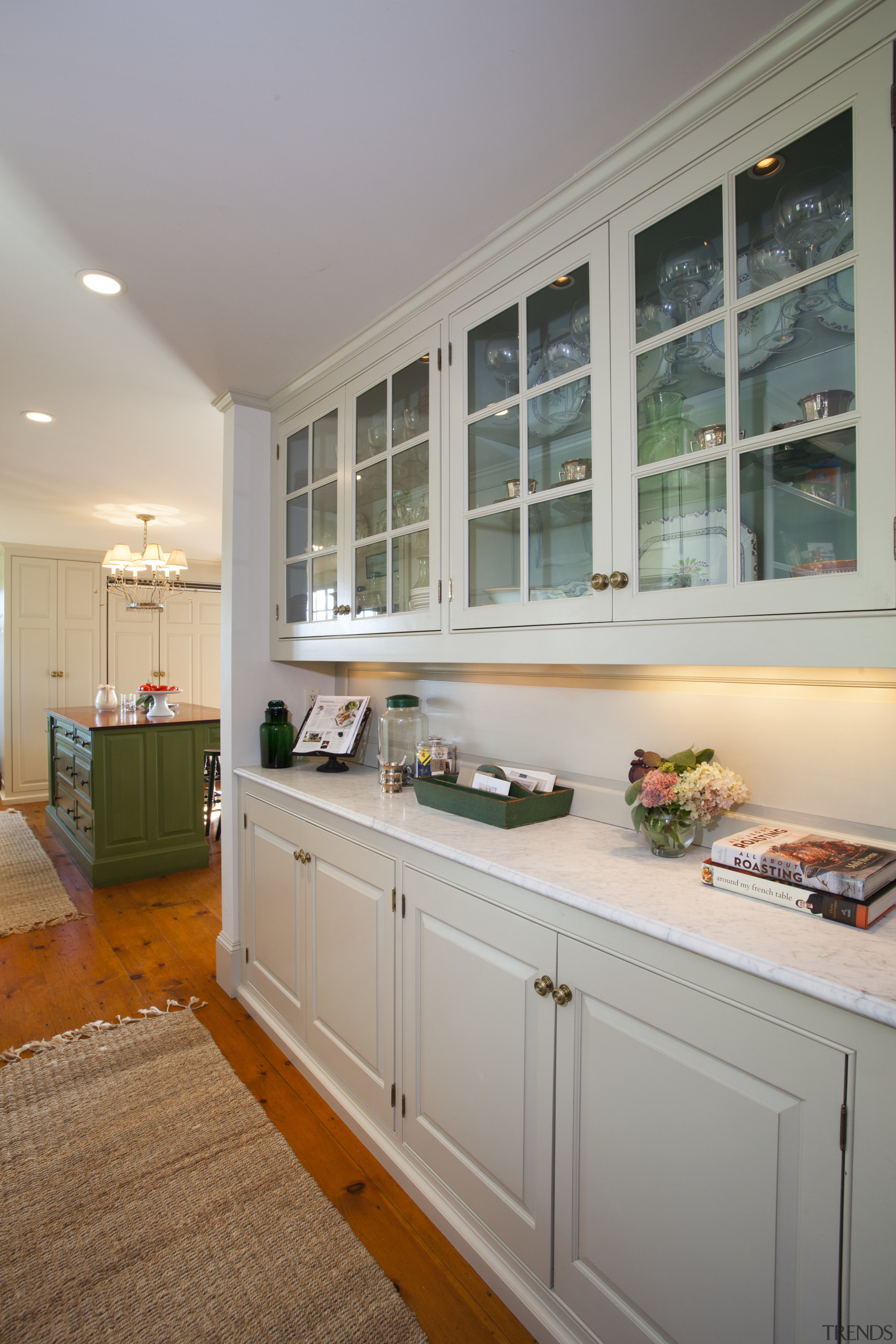 This kitchen blends with its surroundings through architectural cabinetry, countertop, cuisine classique, home, interior design, kitchen, real estate, room, window, gray