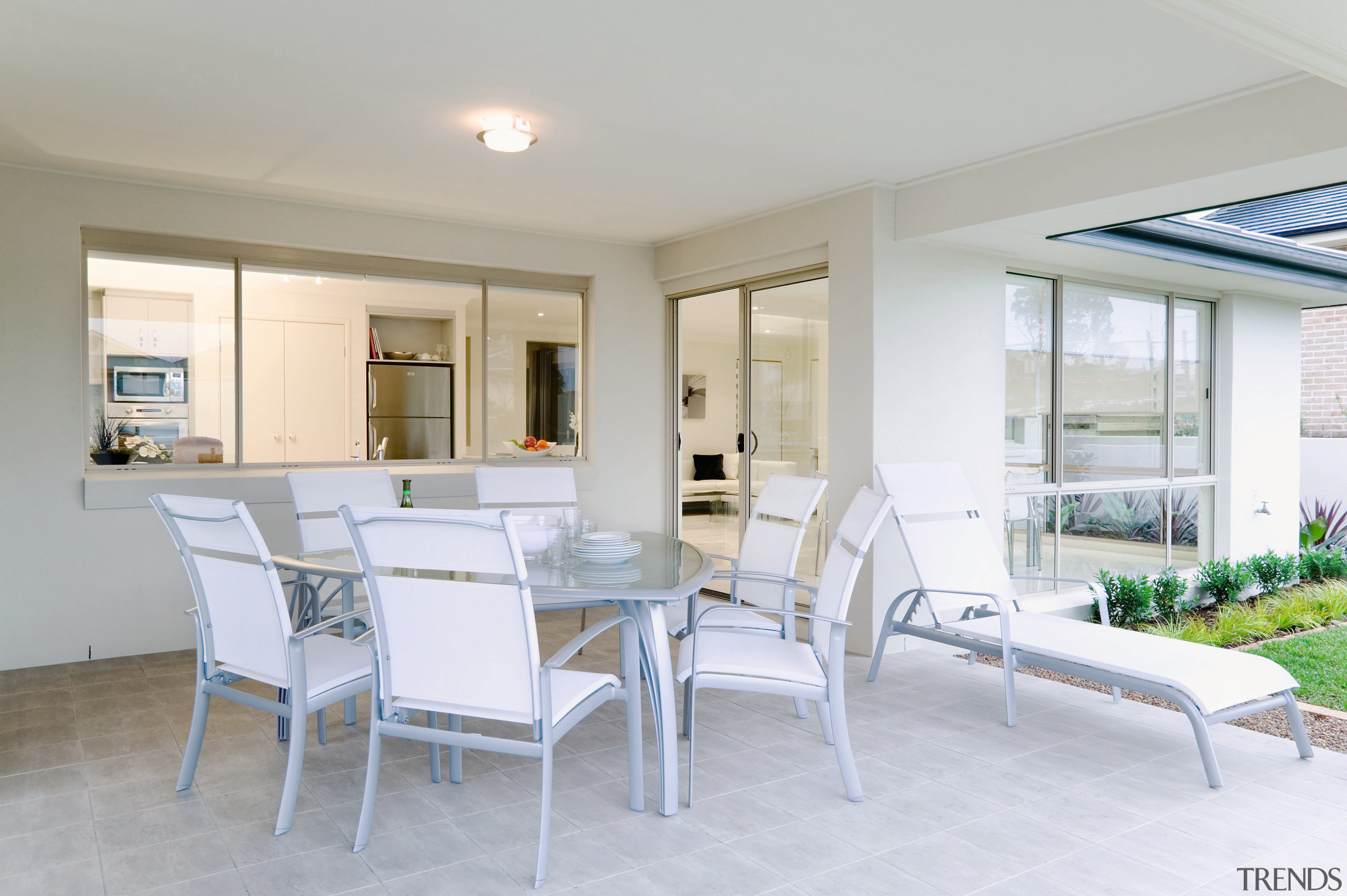 view of the alfresoc dining area that opens apartment, dining room, home, interior design, property, real estate, table, window, gray, white