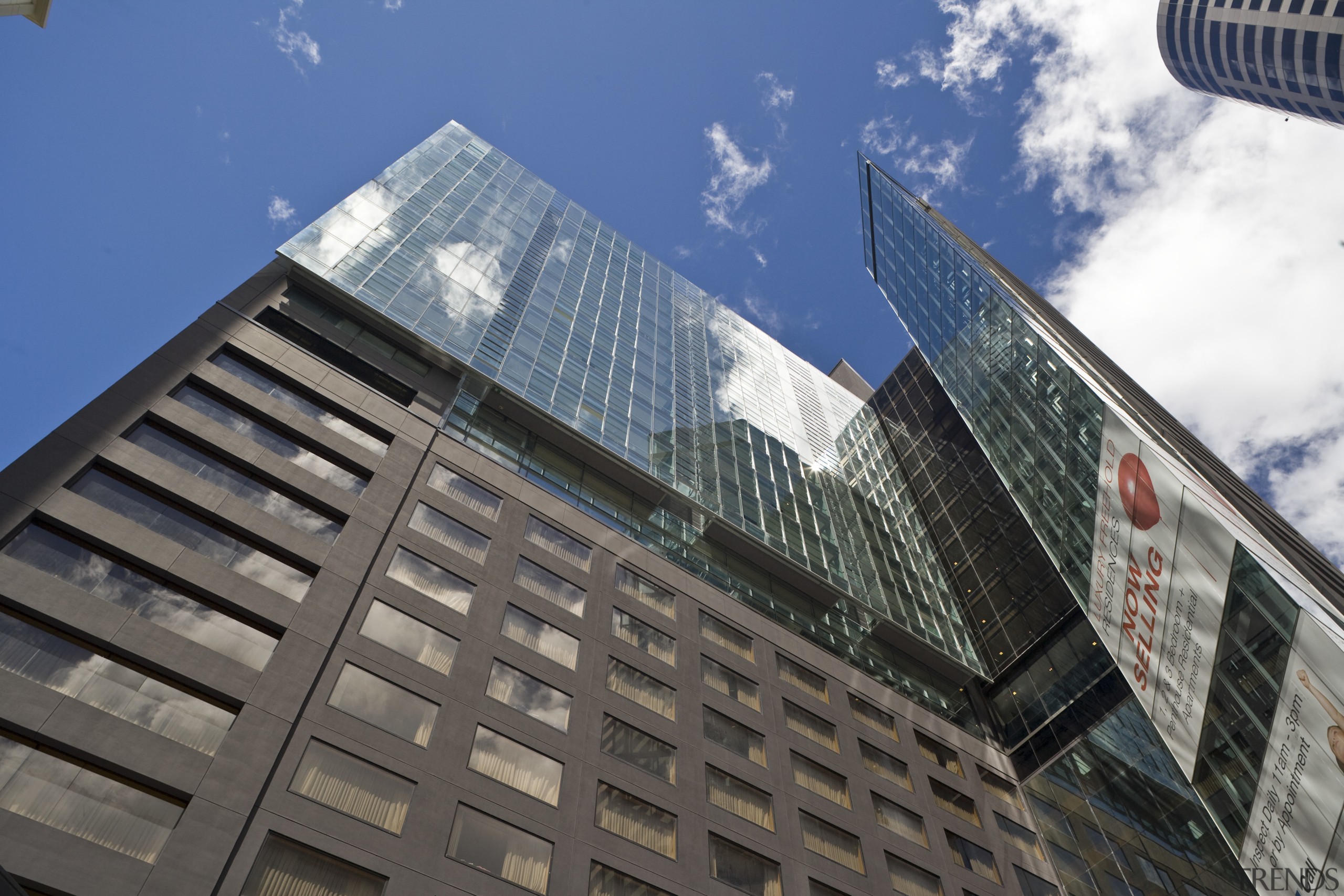 Exterior image of the Stamford apartments which Thermosash architecture, building, city, cloud, commercial building, condominium, corporate headquarters, daytime, facade, headquarters, landmark, metropolis, metropolitan area, reflection, sky, skyscraper, tower, tower block, urban area, gray, blue
