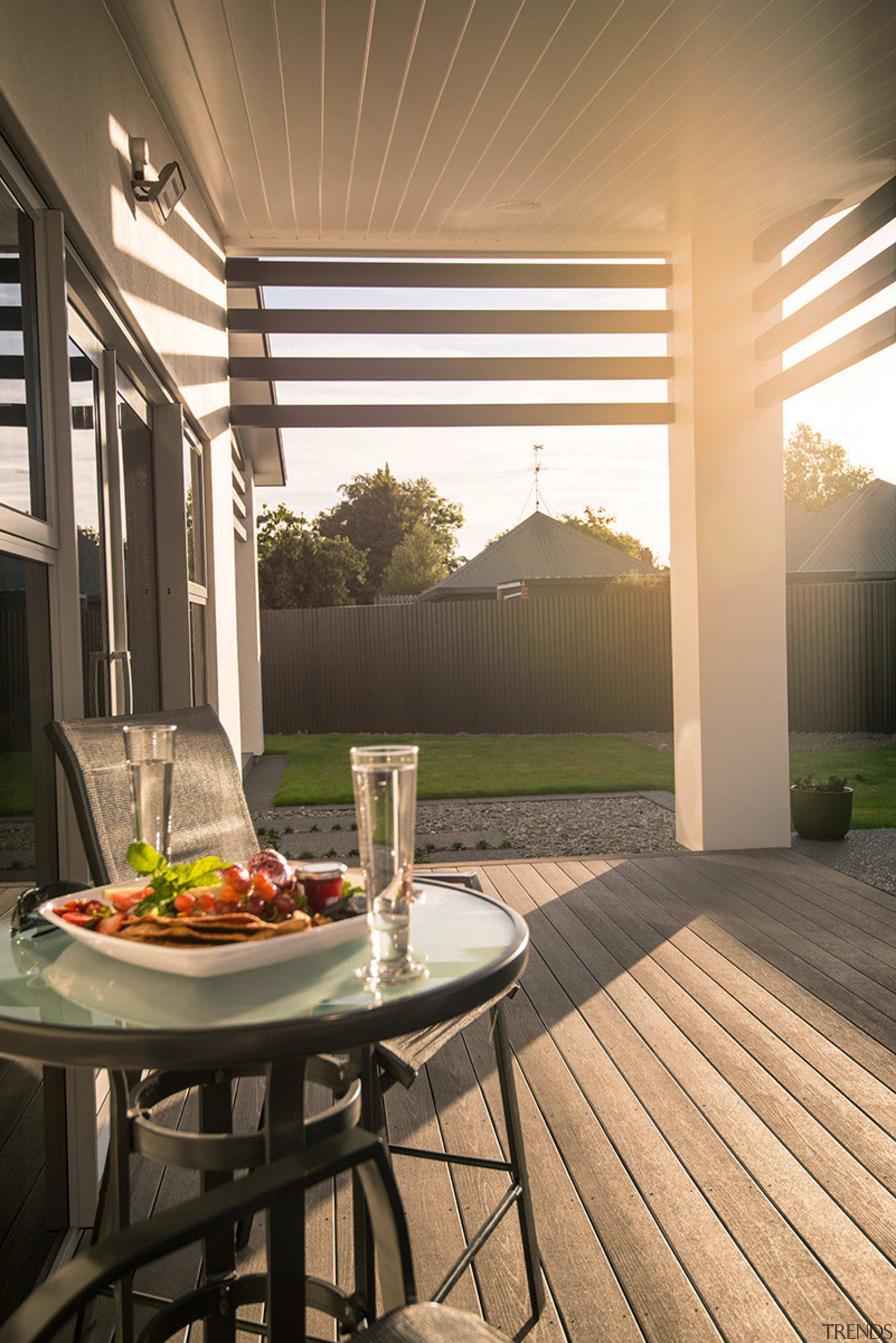 Complete your outdoor living area with a porch, backyard, deck, home, house, interior design, outdoor structure, patio, porch, real estate, table, window, brown, orange