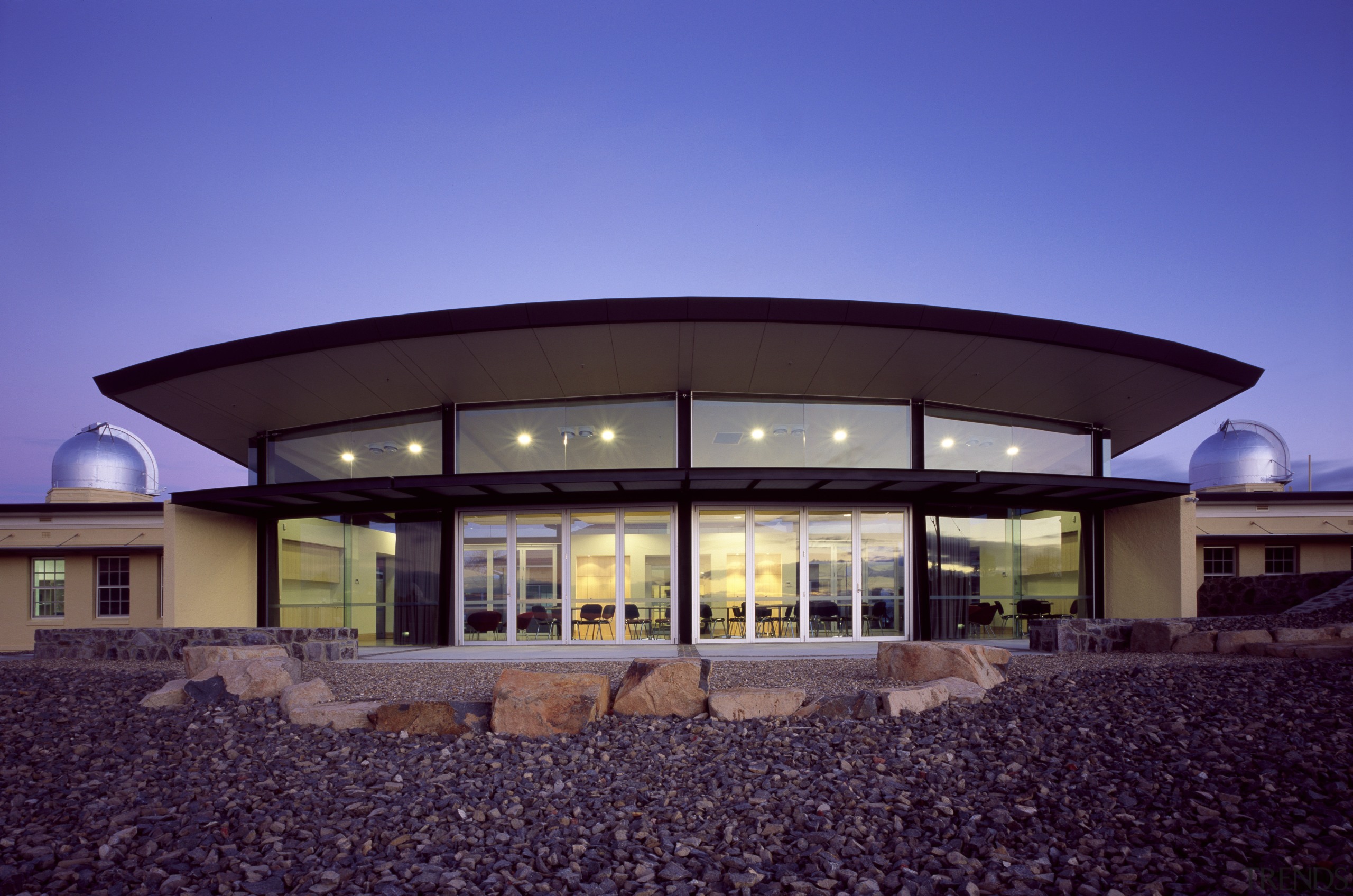 Exterior view of the observatory which features steel architecture, corporate headquarters, elevation, estate, facade, home, house, property, real estate, roof, sky, window, blue, purple