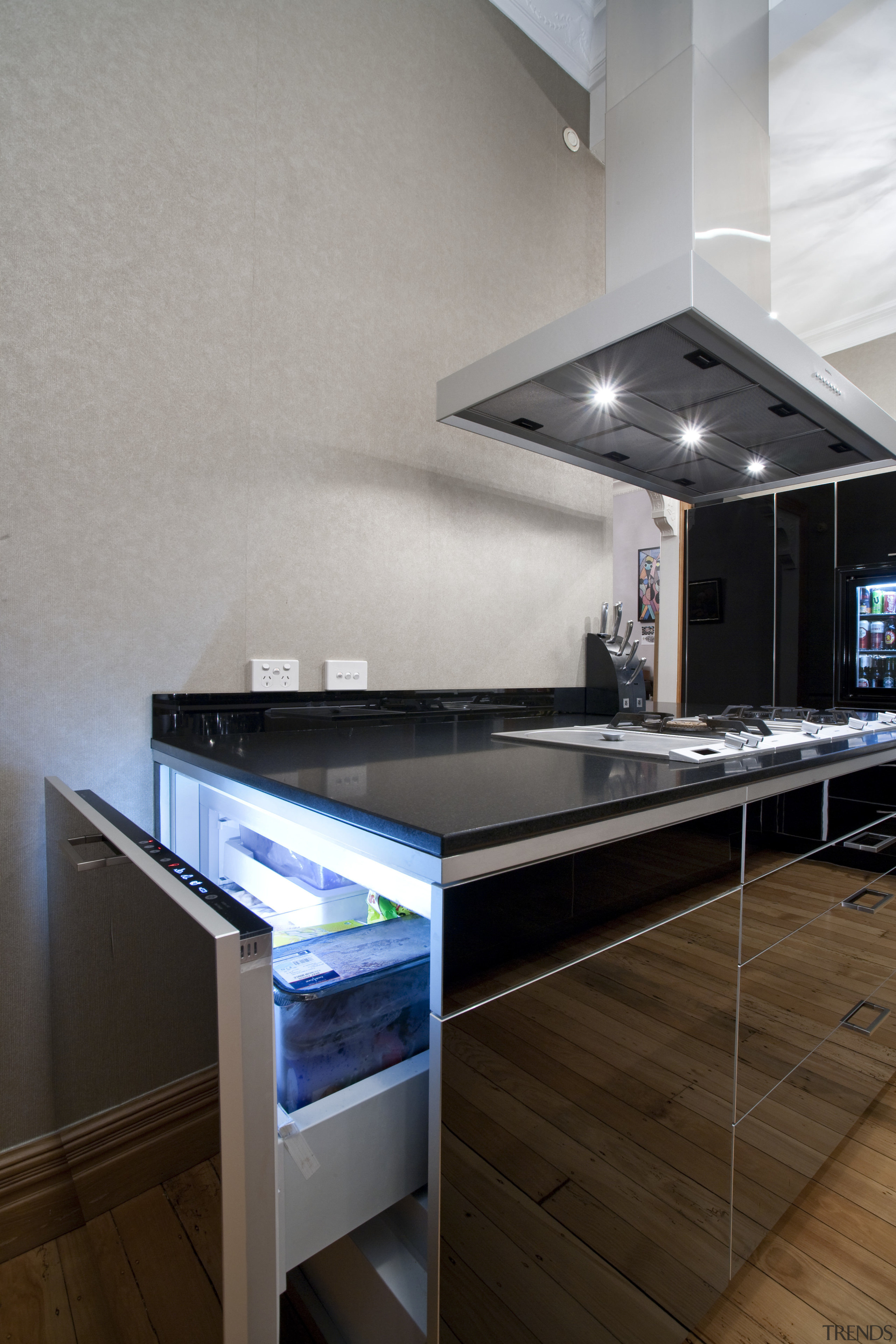 View of contemporary kitchen with dark cabinets and countertop, interior design, kitchen, room, gray, brown