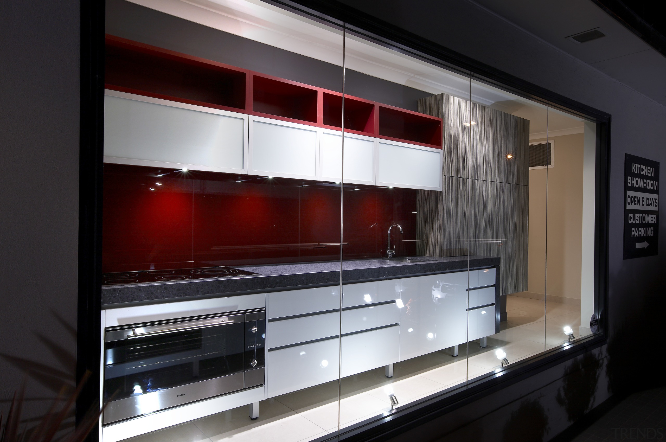 View of an Apollo Kitchens showroom which showcases cabinetry, countertop, interior design, kitchen, black