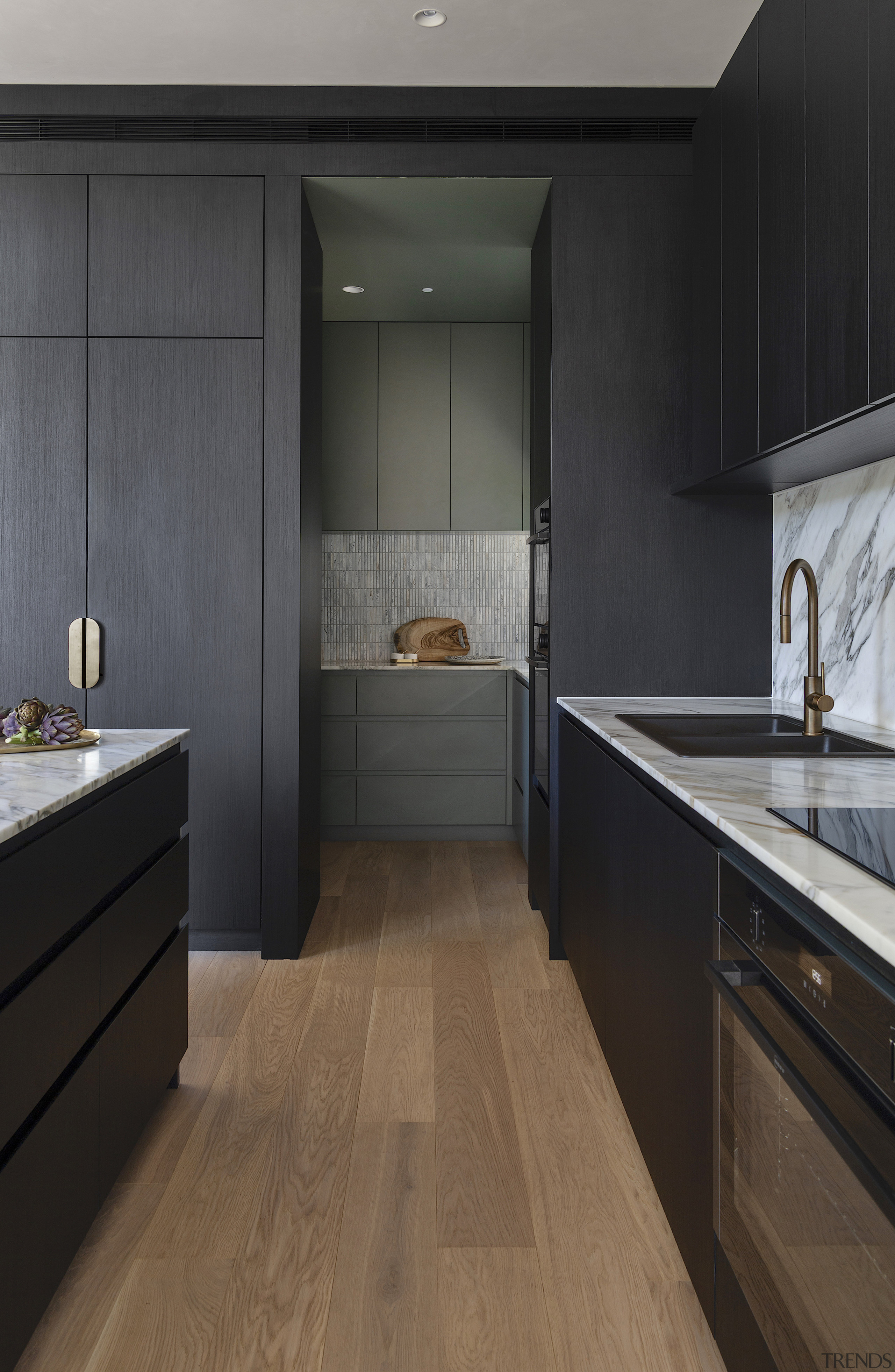 Wood floors add warmth to the pared back, 