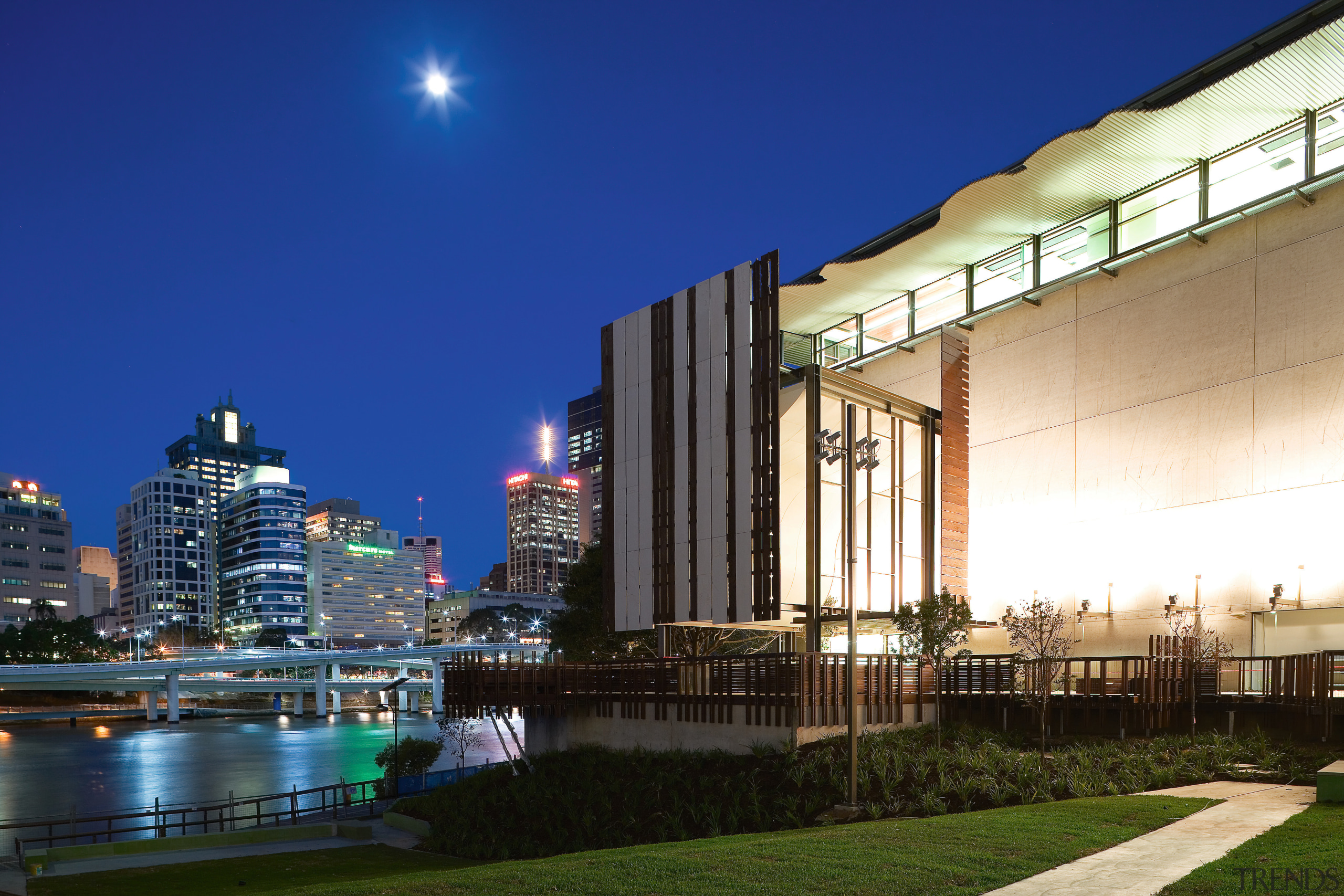 A view of the two buildings which form architecture, building, city, cityscape, condominium, corporate headquarters, downtown, evening, hotel, lighting, metropolis, metropolitan area, mixed use, night, real estate, reflection, sky, skyline, skyscraper, urban area, water, blue