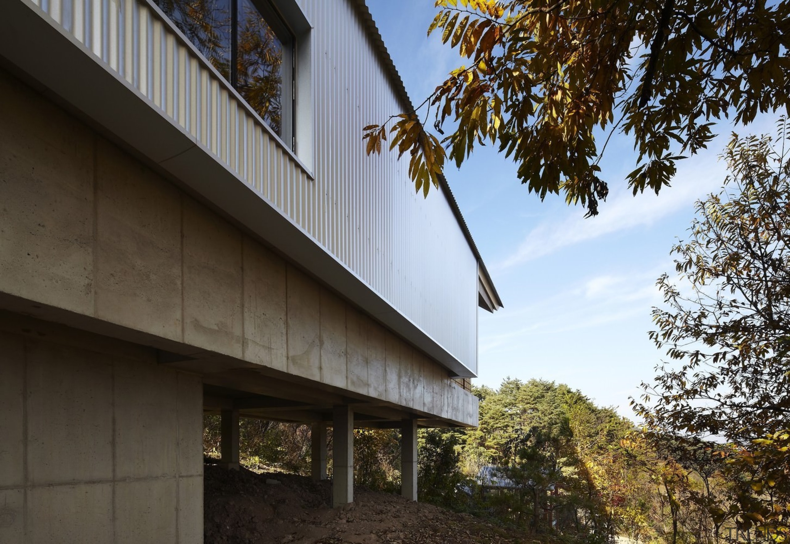 Being elevated means the home is protected from architecture, building, facade, house, real estate, sky, tree, wood, black