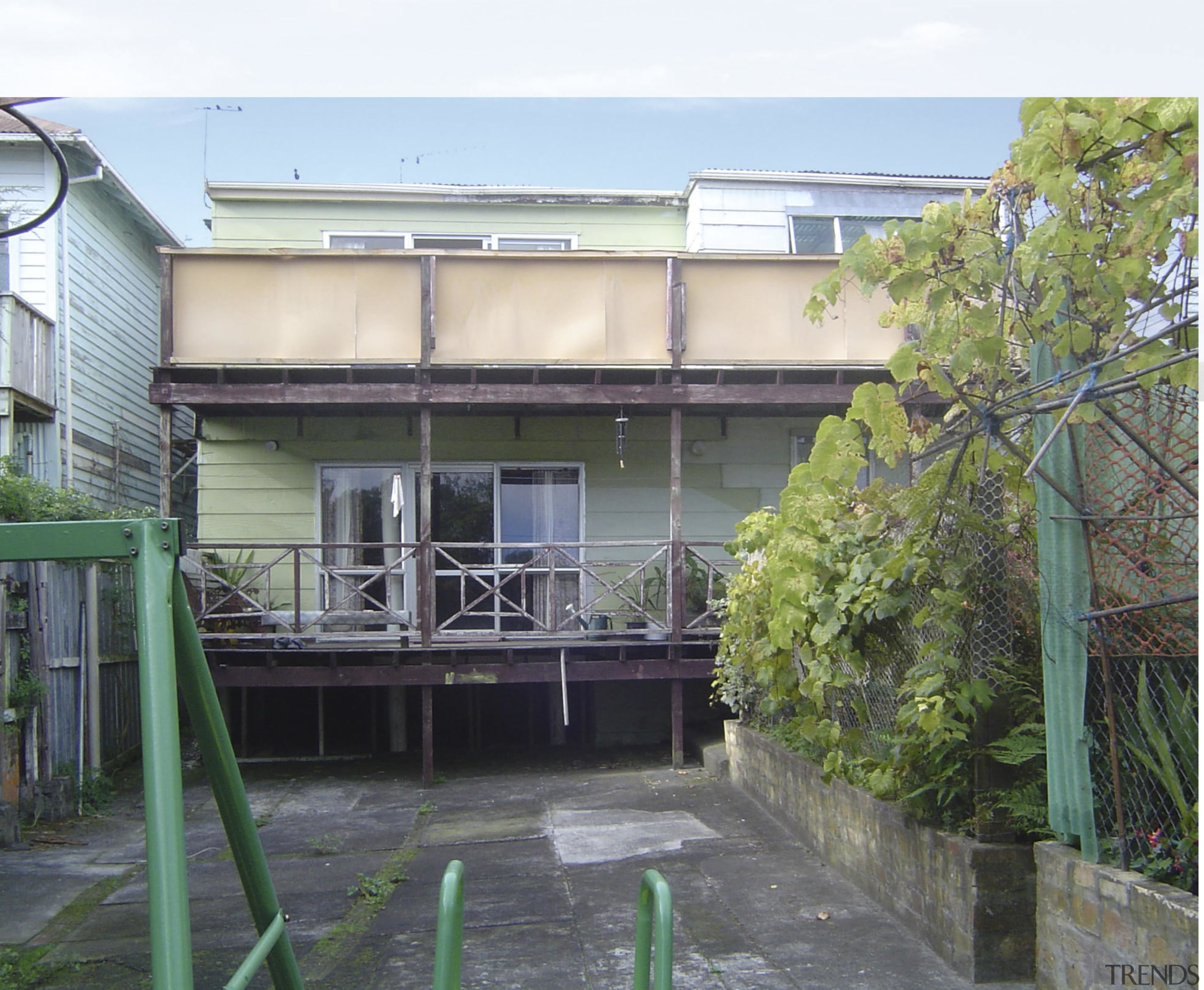 A view of a home before it was apartment, facade, house, property, real estate, residential area, white, gray