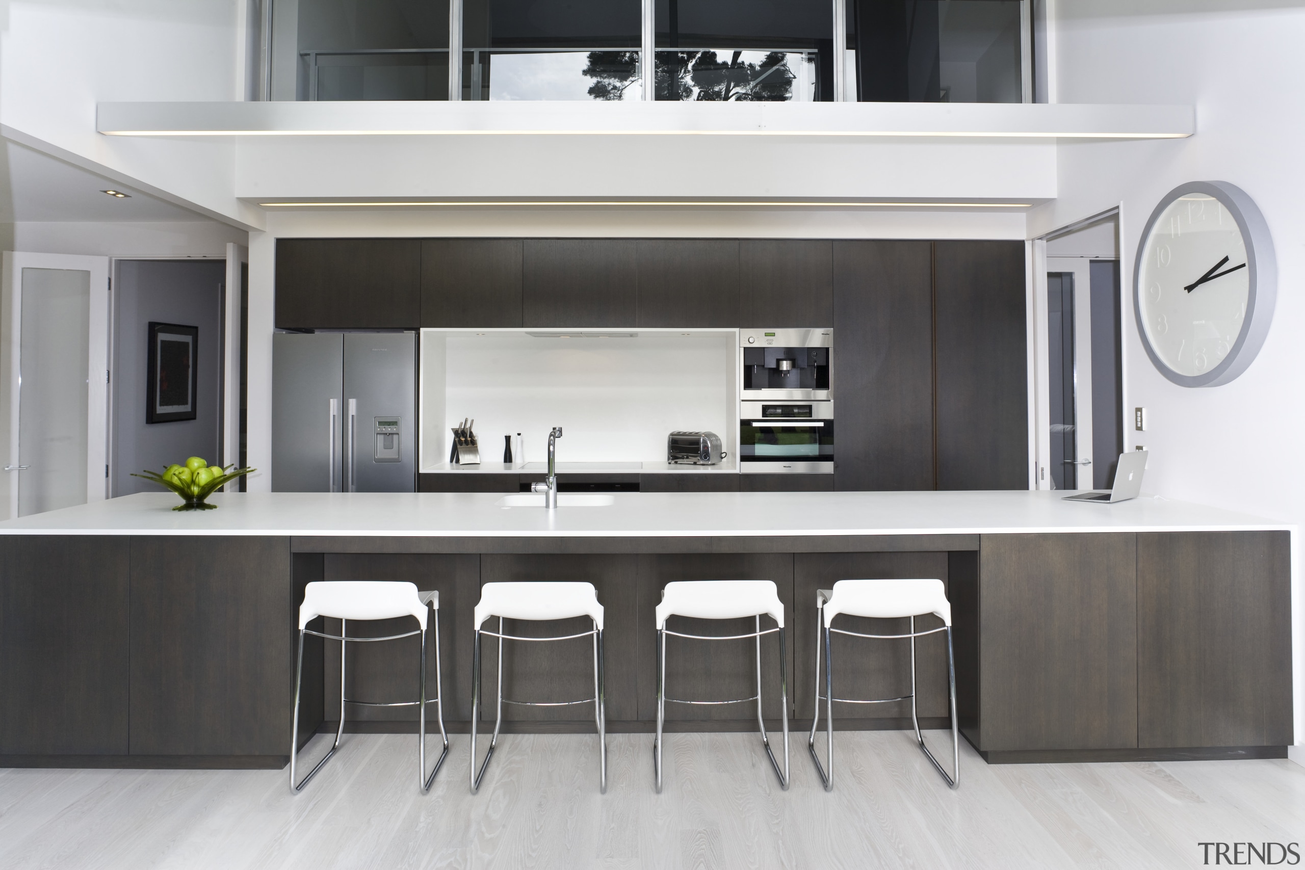 View of kitchen featuring large island, dark-stained oak countertop, cuisine classique, furniture, interior design, kitchen, product design, table, white, black
