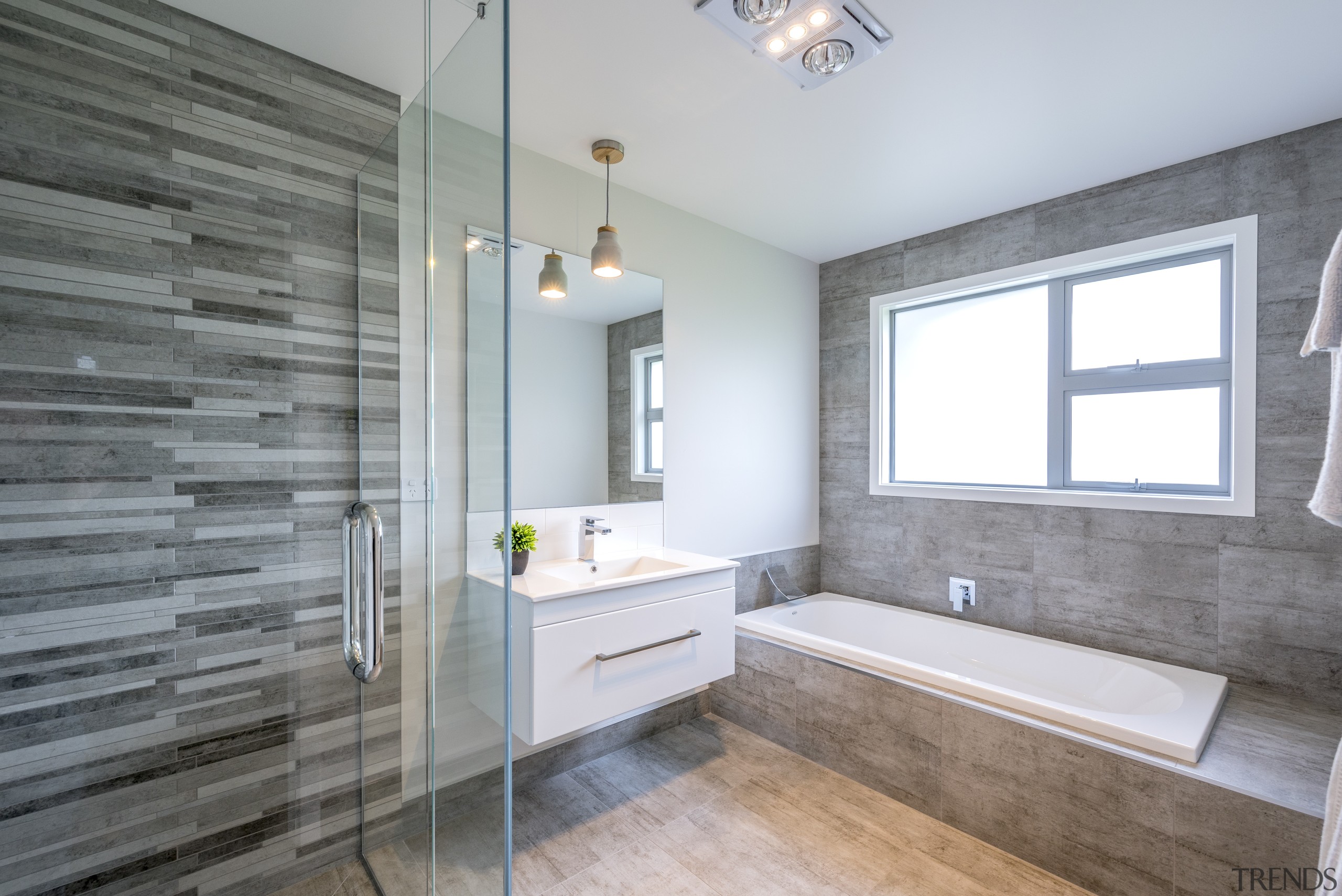 This master ensuite has feature tiles and a architecture, bathroom, daylighting, estate, floor, flooring, home, interior design, real estate, room, tile, window, gray