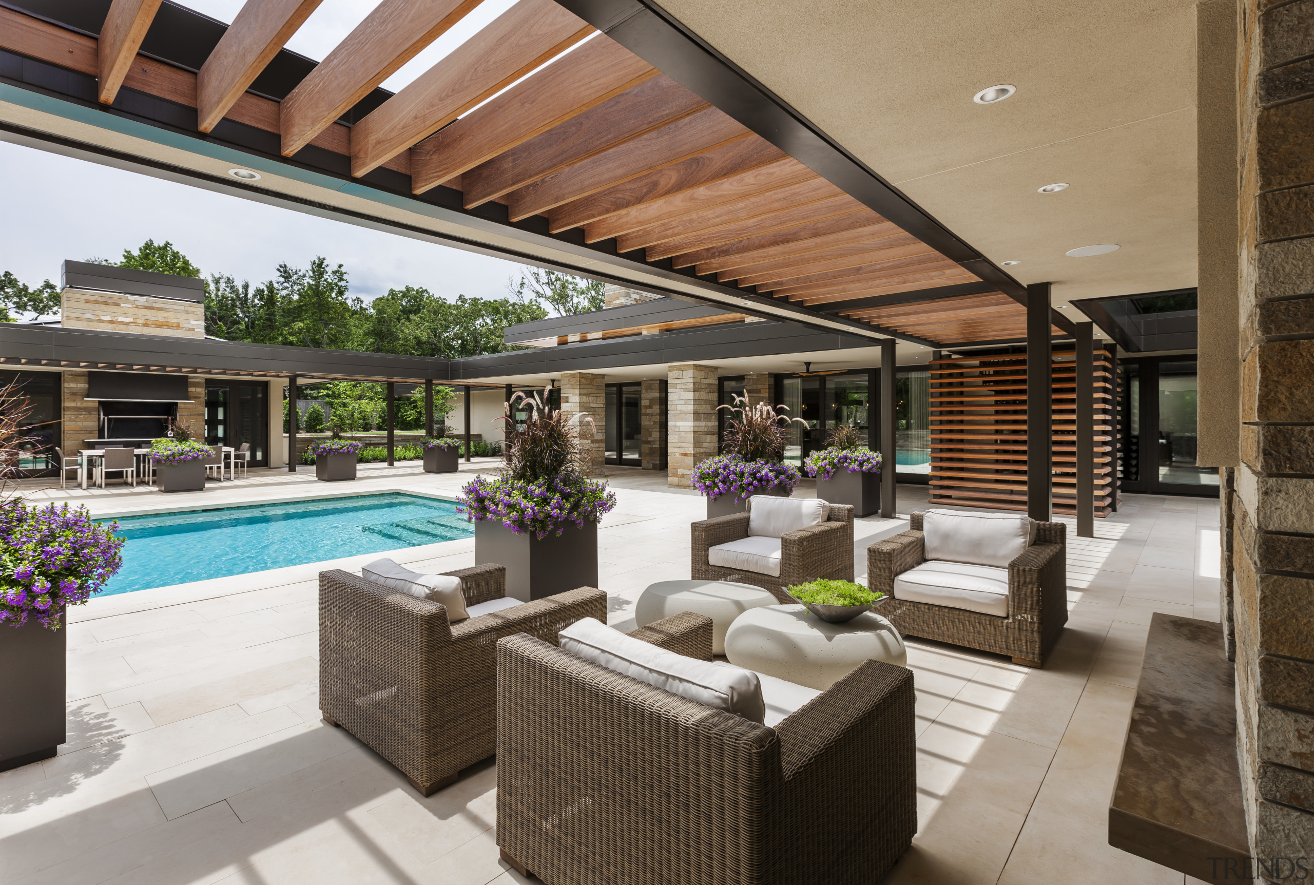 A trellis walkway and extended soffits help to estate, house, interior design, living room, outdoor structure, patio, property, real estate, resort, swimming pool, gray, black