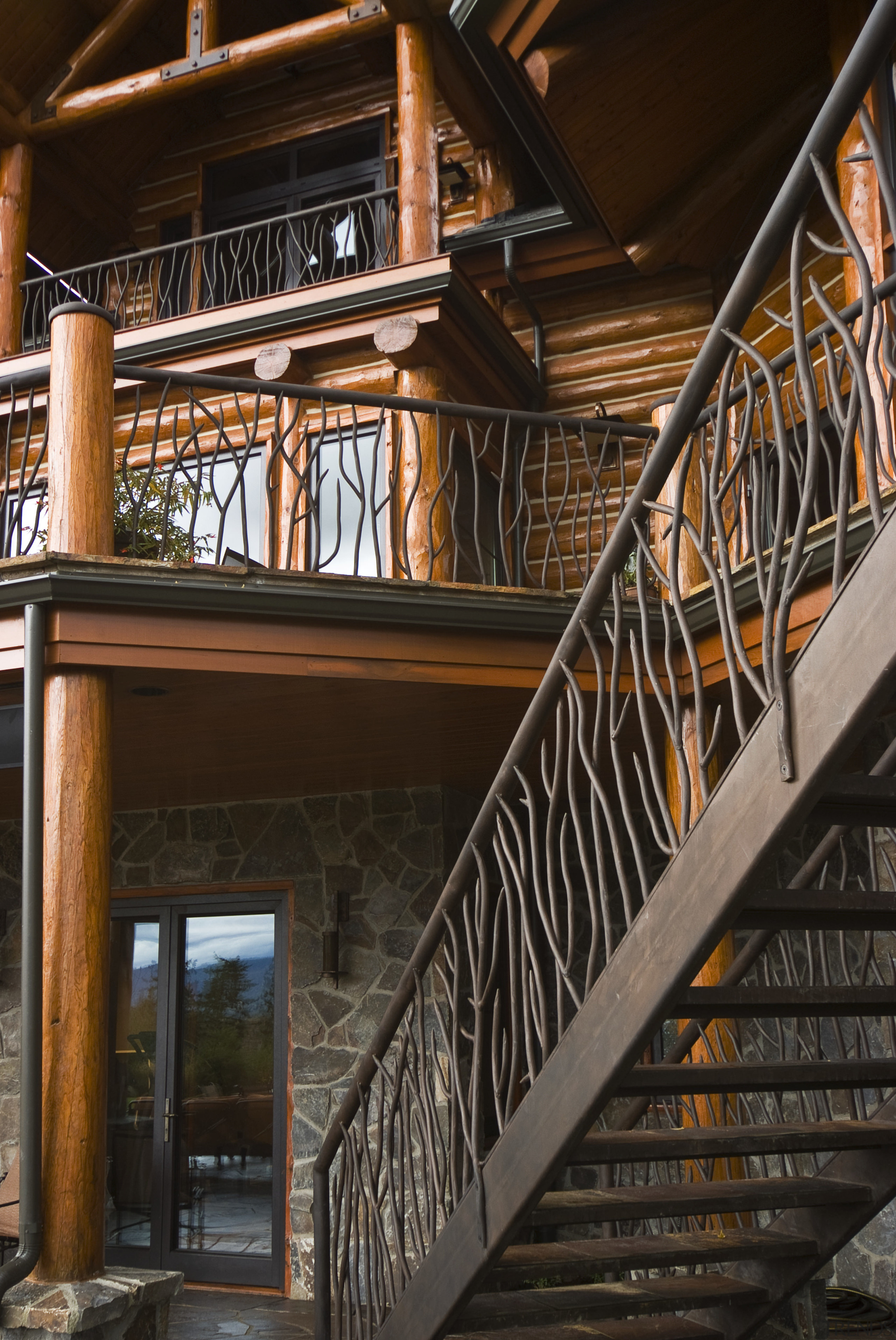 Image of handrail which has been designed and balcony, baluster, building, handrail, iron, stairs, wood, black, brown