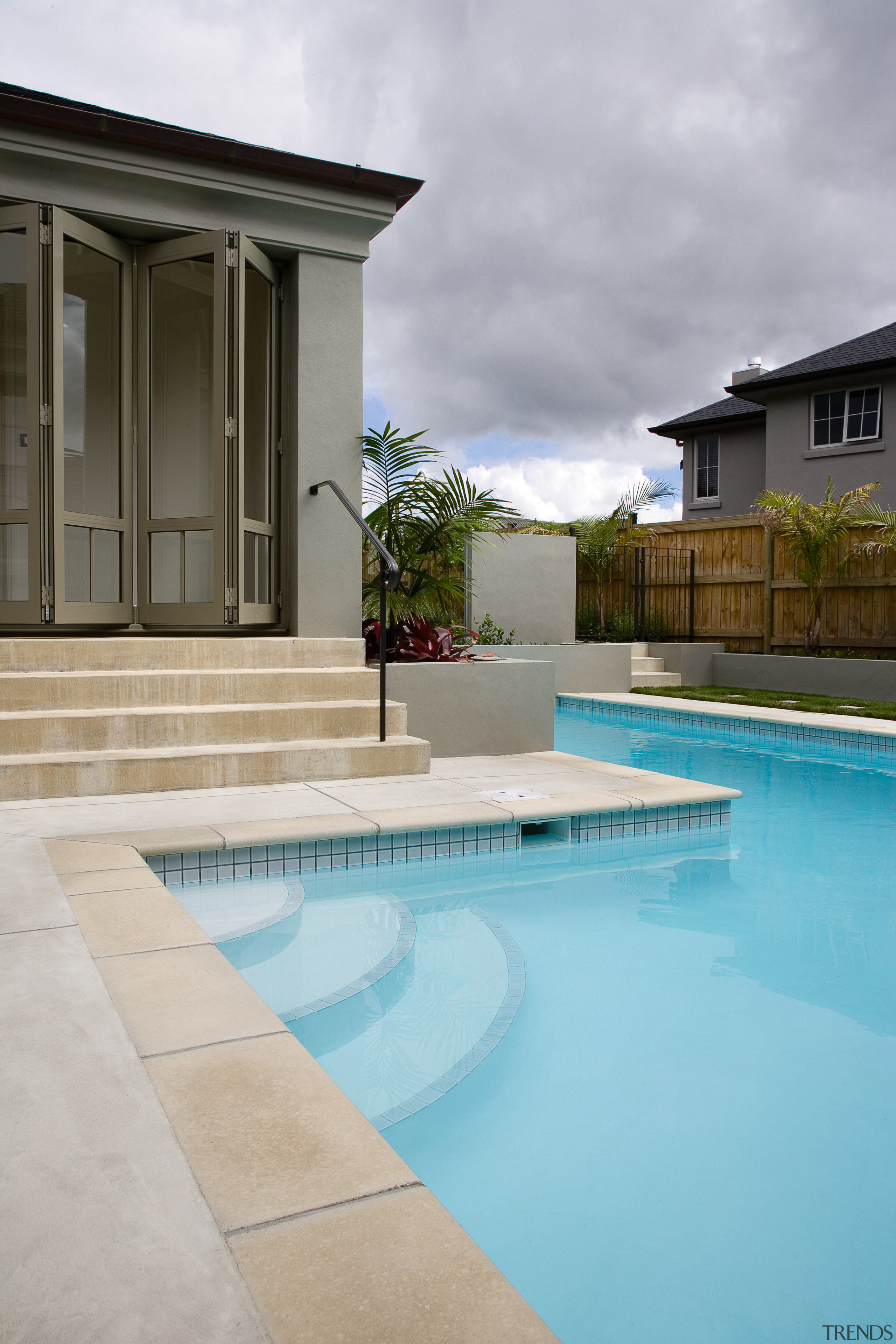 A close up view of a swimming pool architecture, estate, home, house, property, real estate, reflection, residential area, sky, swimming pool, villa, water, gray