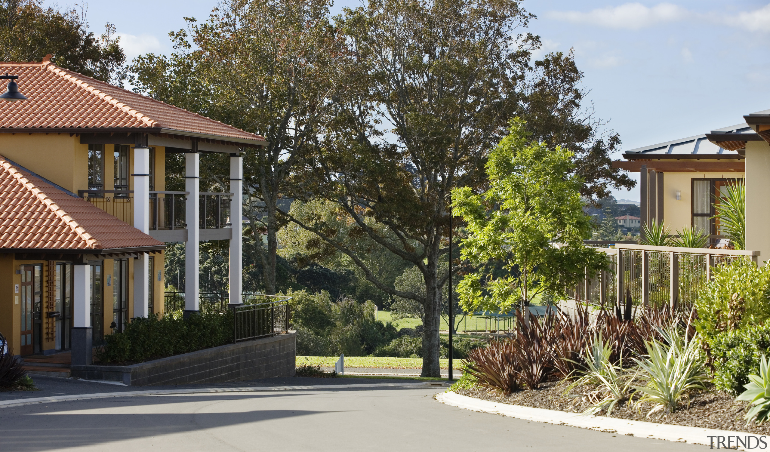 Single-and double-storey houses provide a variety of residential cottage, estate, facade, home, house, landscaping, neighbourhood, plant, property, real estate, residential area, suburb, tree, yard, brown, white