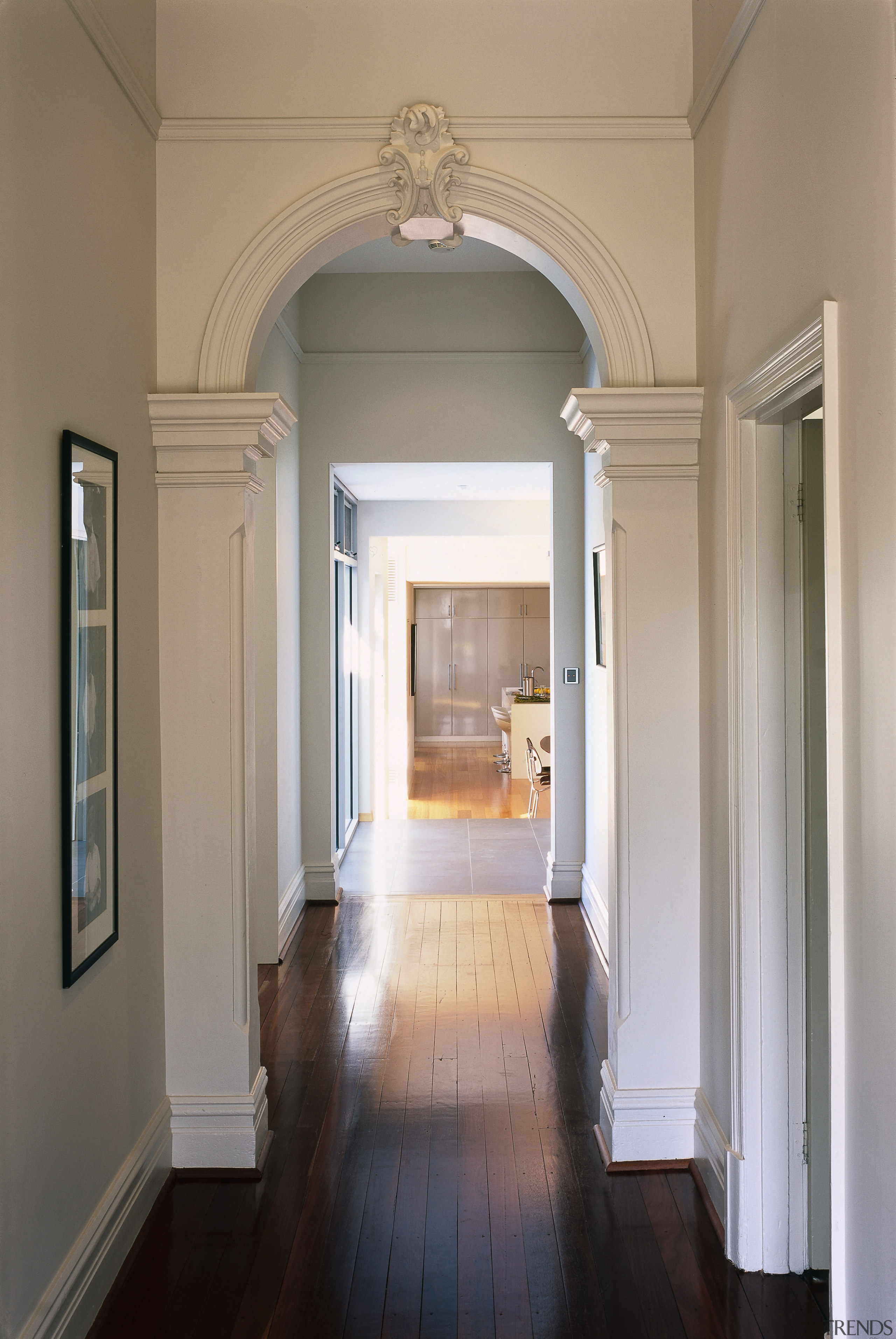 Interior view of the hallway. - Interior view architecture, ceiling, column, door, estate, floor, flooring, hall, hardwood, home, house, interior design, molding, real estate, structure, wall, window, gray