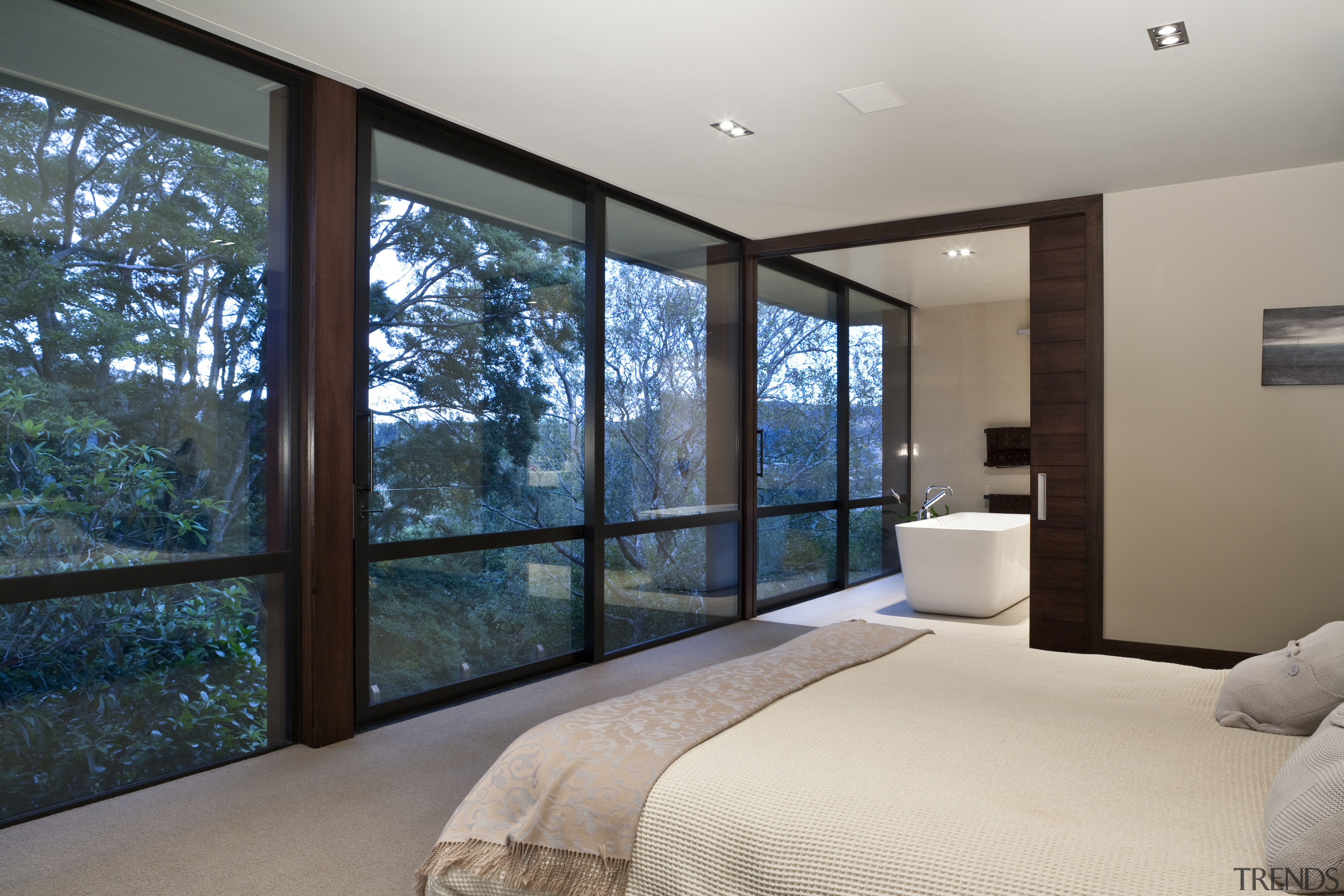 View of the bedroom which features bed with architecture, bedroom, ceiling, door, estate, home, house, interior design, property, real estate, room, wall, window, gray