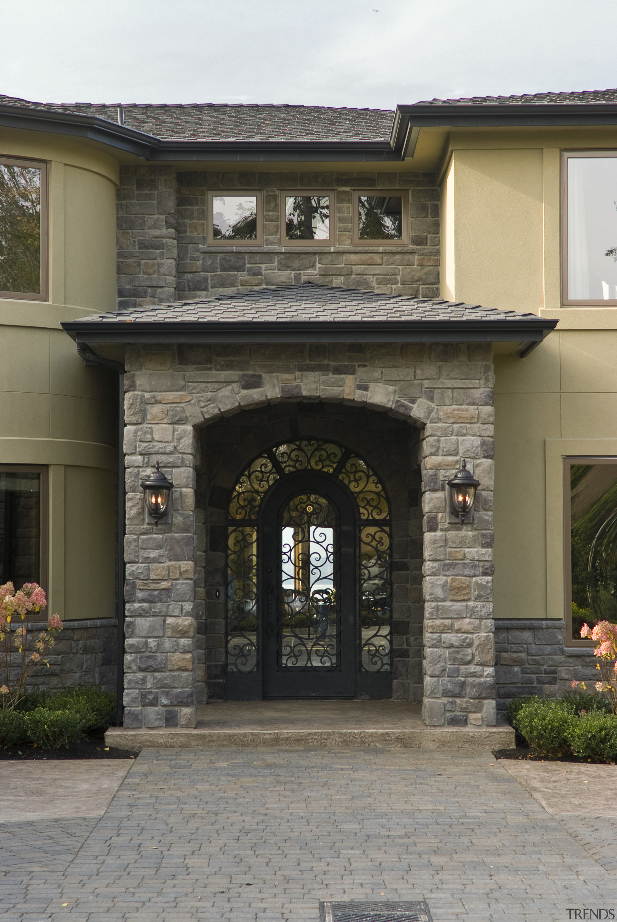 Images of the exterior of this home with arch, brick, door, estate, facade, gate, home, house, real estate, residential area, window, gray, black