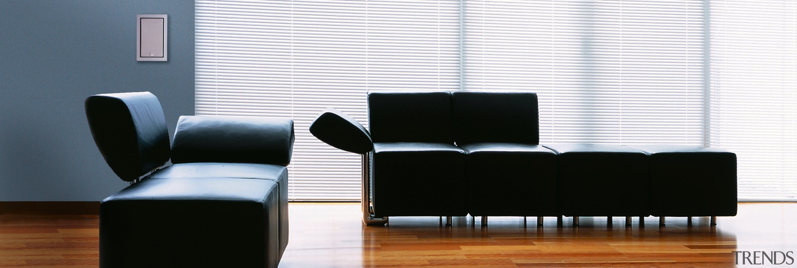 Interior view of entertainment area - Interior view angle, chair, couch, floor, furniture, interior design, living room, product, product design, recliner, sofa bed, table, waiting room, wall, wood, white