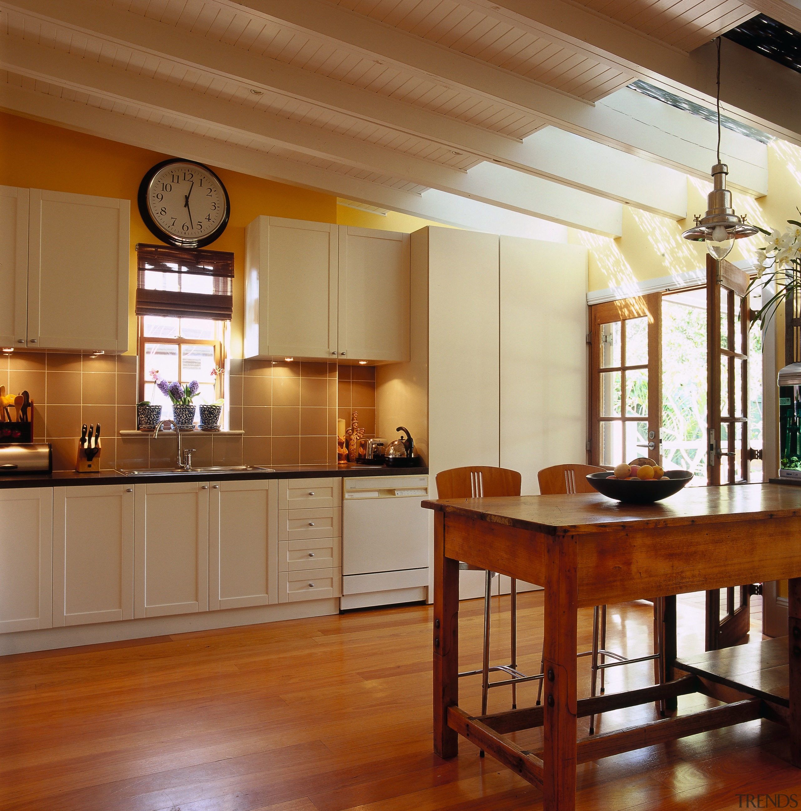 View of the kitchen &amp; dining area - cabinetry, ceiling, countertop, cuisine classique, dining room, floor, flooring, hardwood, interior design, kitchen, real estate, room, table, wood, wood flooring, brown