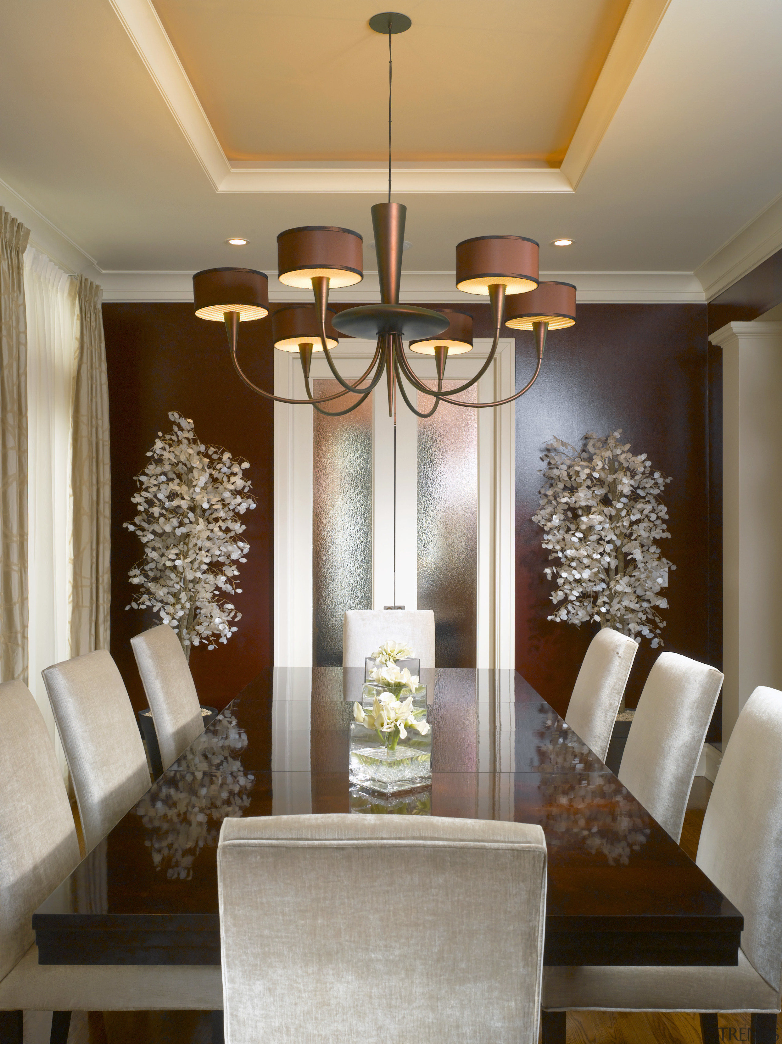 The Art Deco-inspired dinning room is open on ceiling, chandelier, decor, dining room, home, interior design, light fixture, lighting, living room, molding, room, wall, window, brown, gray