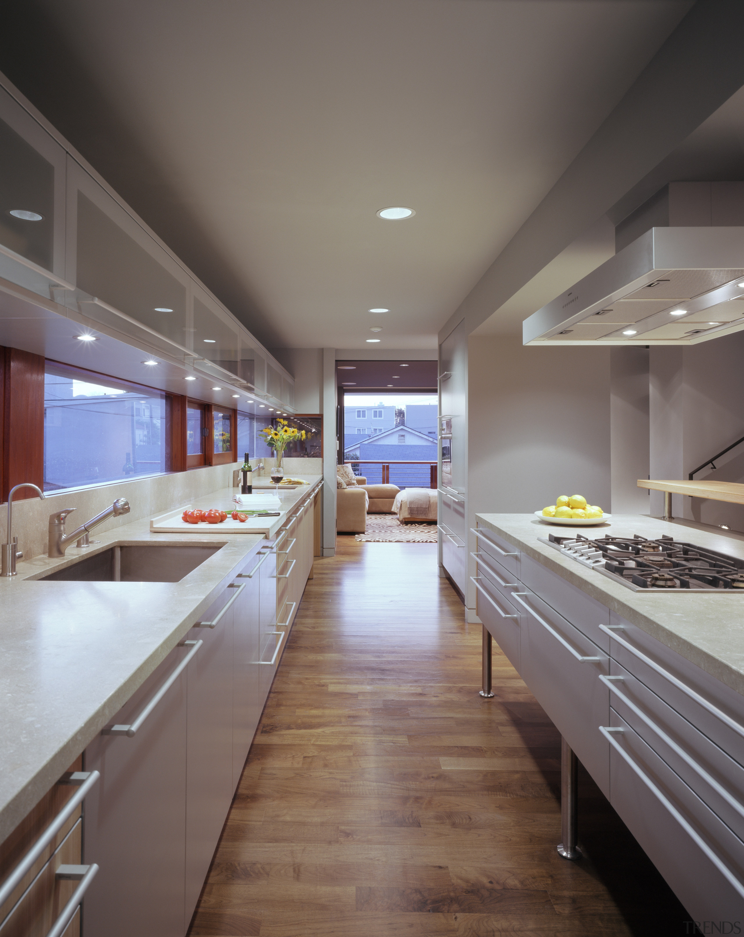 The kitchen is designed in a galley style ceiling, countertop, floor, interior design, kitchen, room, gray
