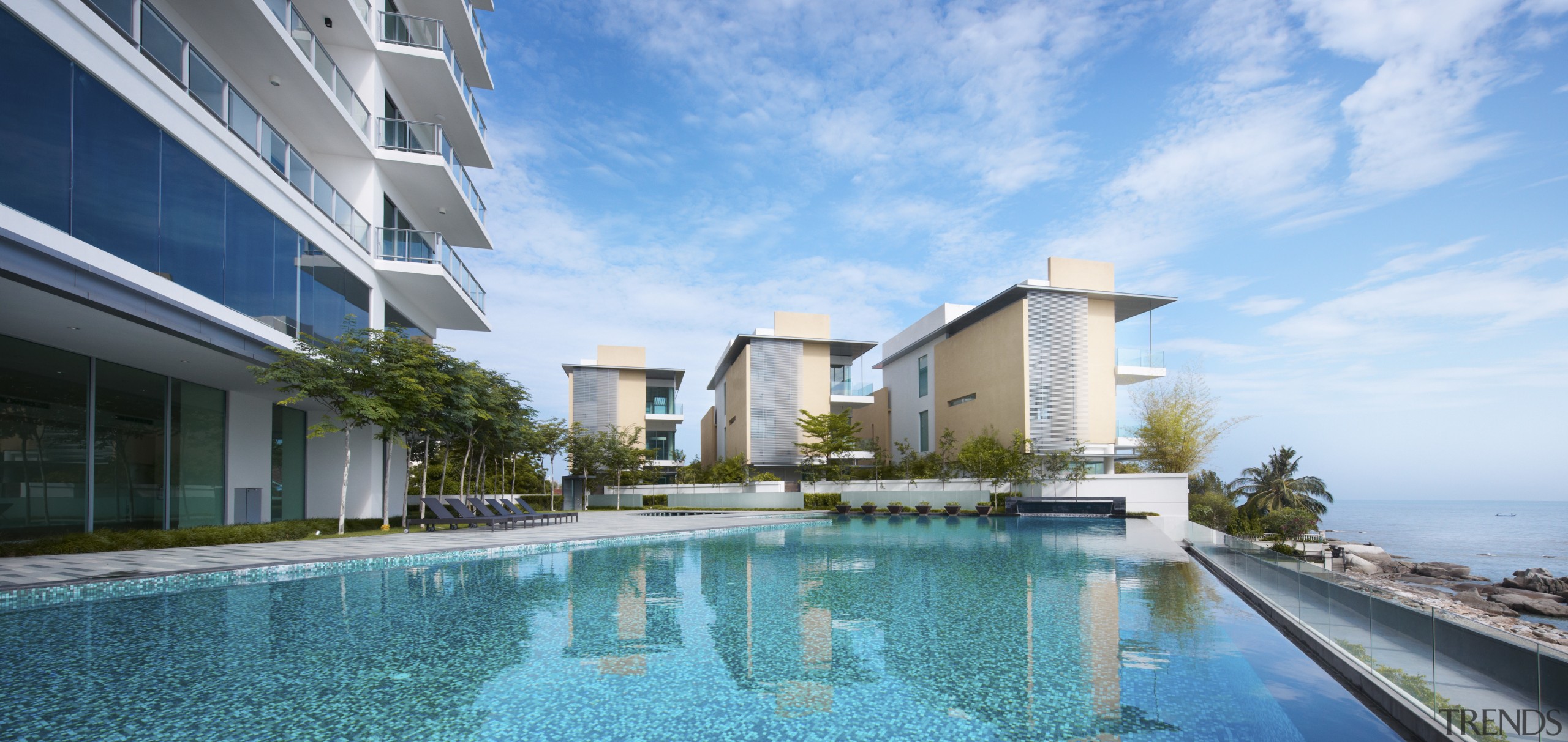 Exterior view of the Springtide Residence on Penang apartment, condominium, estate, home, hotel, leisure, property, real estate, resort, resort town, sky, swimming pool, vacation, villa, teal
