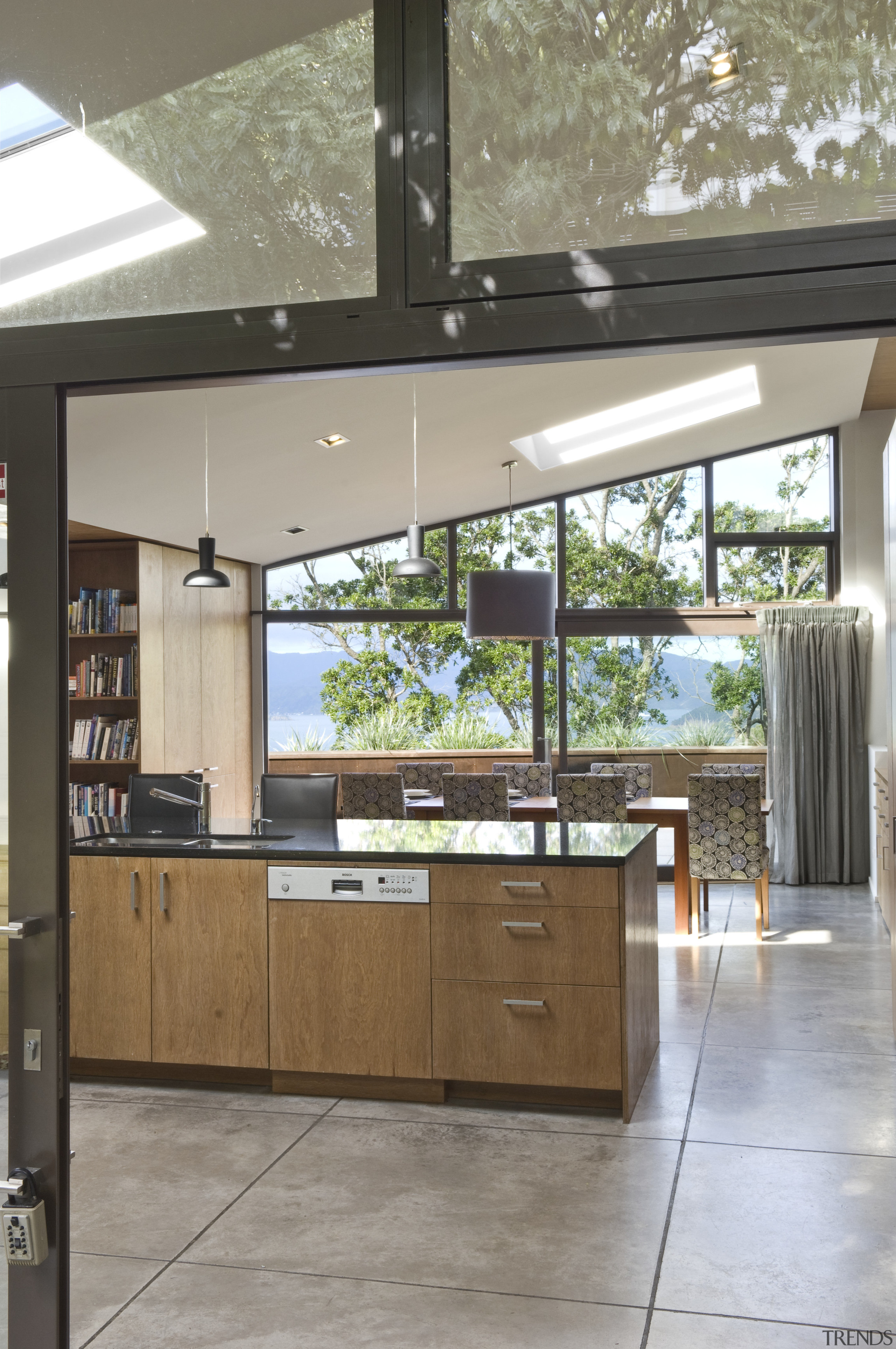 View of open-plan kitchen and dining area with architecture, cabinetry, countertop, daylighting, house, interior design, kitchen, window, gray