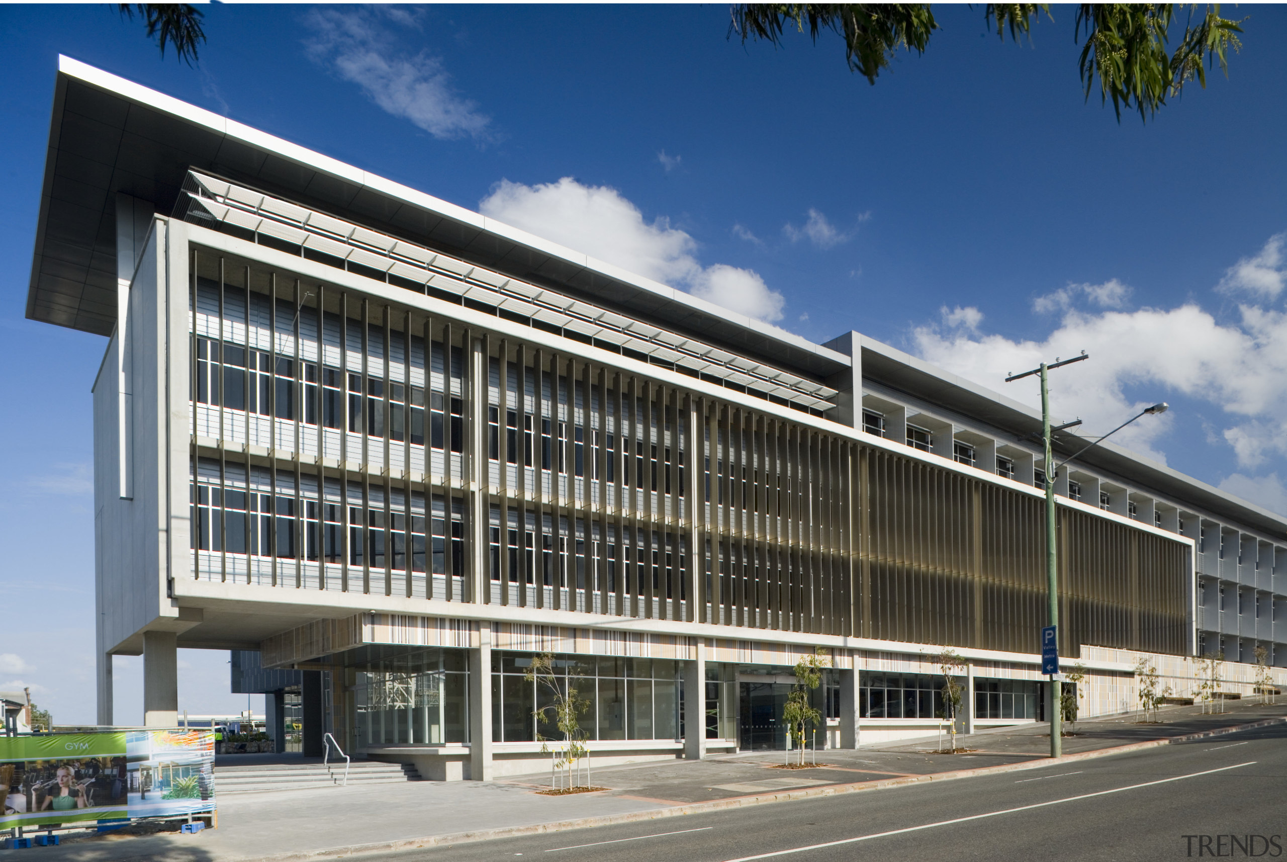 An exterior view of the Greensquare officle tower architecture, building, commercial building, corporate headquarters, facade, headquarters, infrastructure, metropolitan area, mixed use, real estate, sky, structure, black
