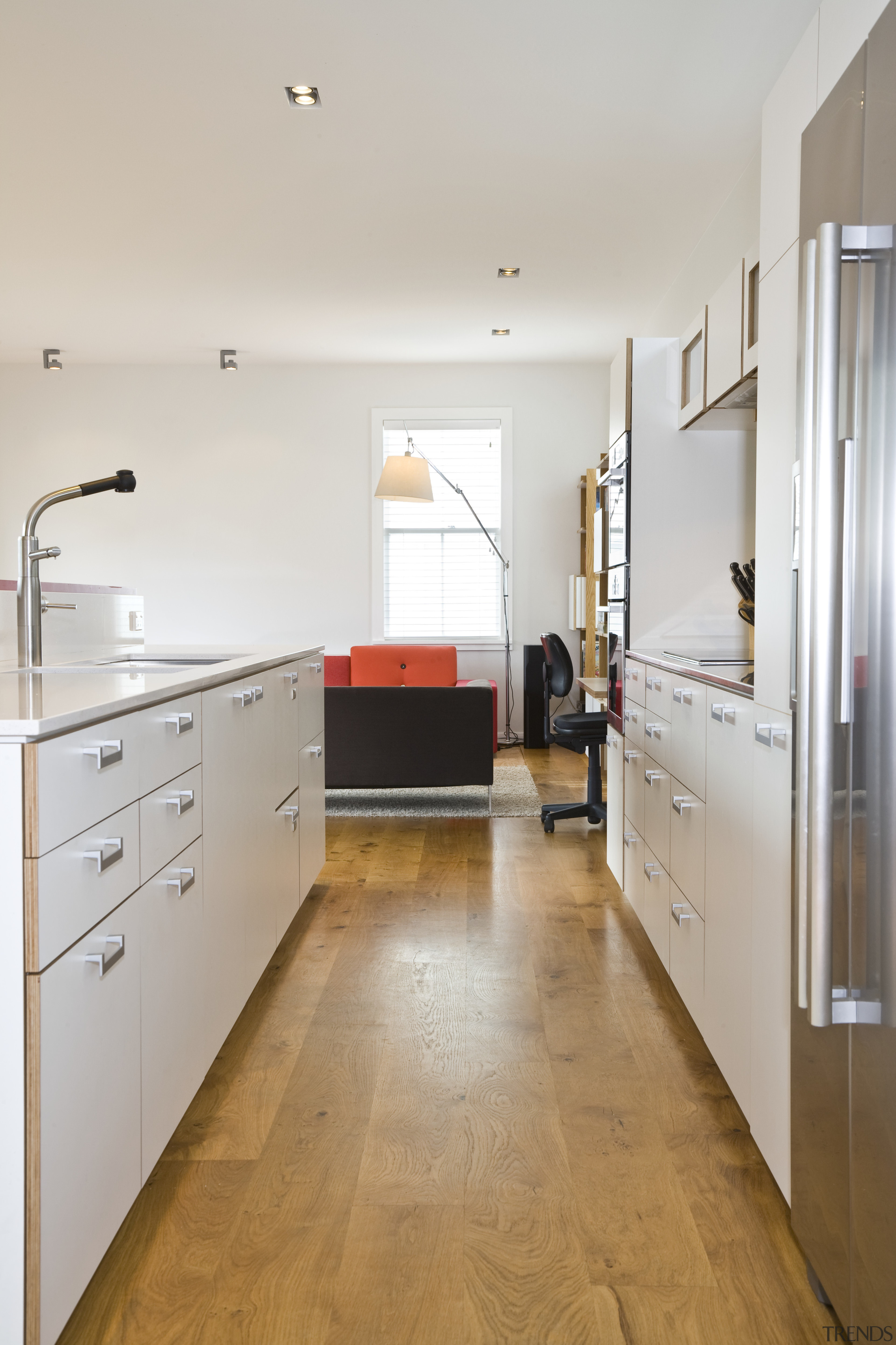 View of open-plan kitchen area which features an cabinetry, countertop, floor, flooring, hardwood, interior design, kitchen, laminate flooring, loft, real estate, room, tile, wood, wood flooring, gray