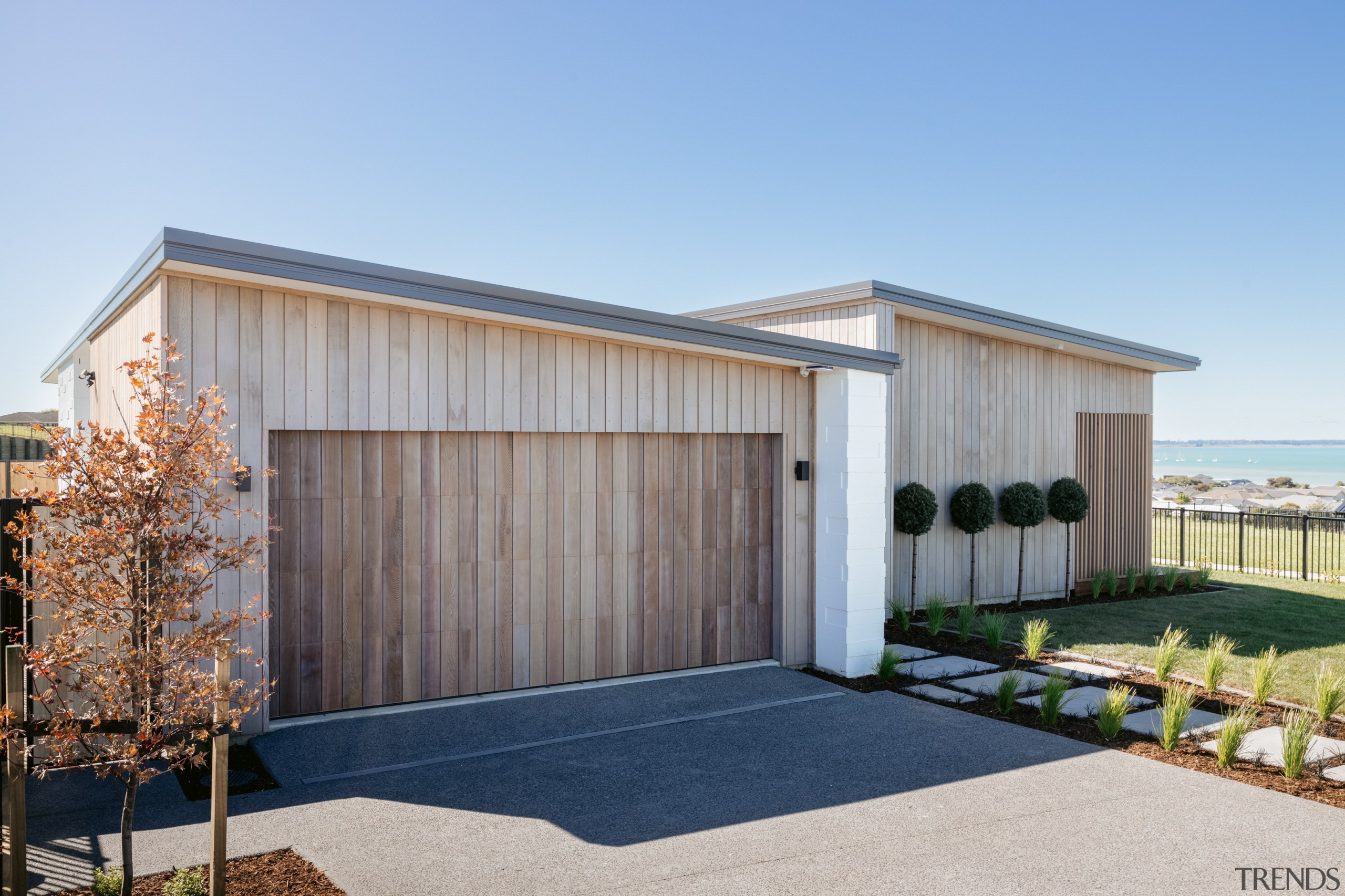 The light-stained cedar cladding is continued in a 