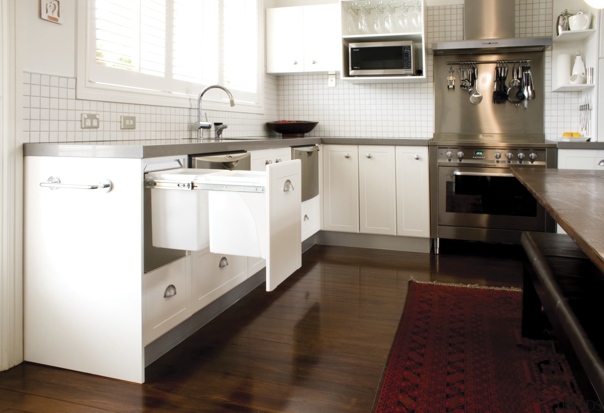 Hideaway Bins from Kitchen King roll out of cabinetry, countertop, cuisine classique, floor, flooring, hardwood, home appliance, interior design, kitchen, kitchen stove, laminate flooring, room, tile, wood flooring, white