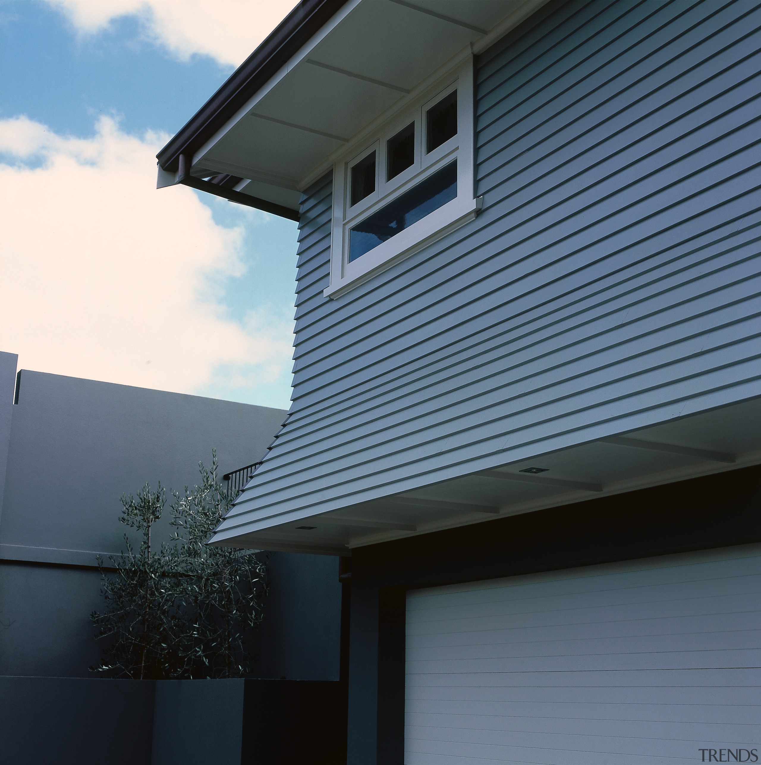 Two storey weatherboard house with flared overhang over architecture, building, daylighting, facade, home, house, line, property, real estate, residential area, roof, siding, sky, window, black