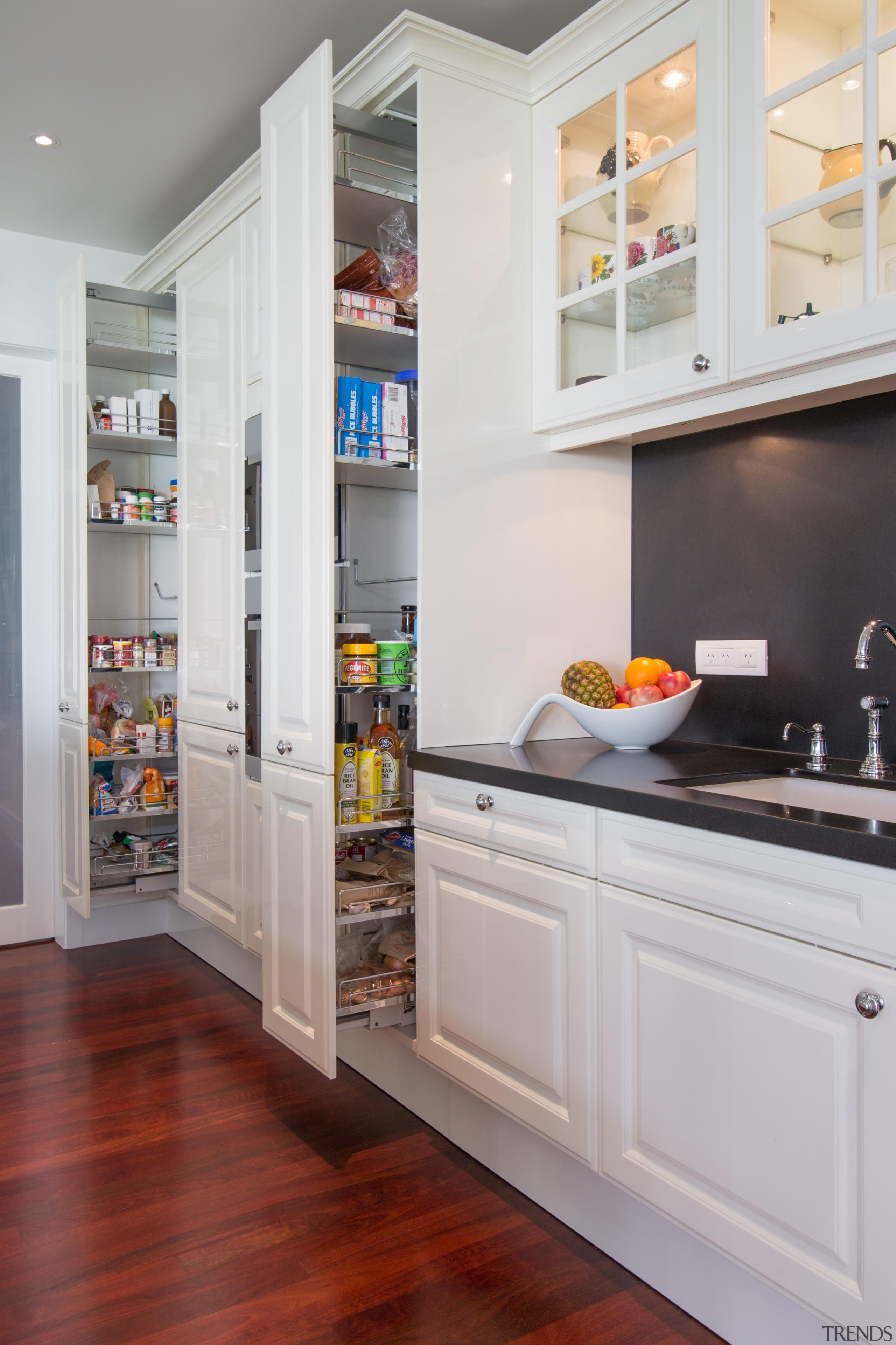 Contemporary technology is combined with timeless aesthetics and cabinetry, countertop, cuisine classique, home appliance, interior design, kitchen, major appliance, refrigerator, room, shelf, shelving, gray