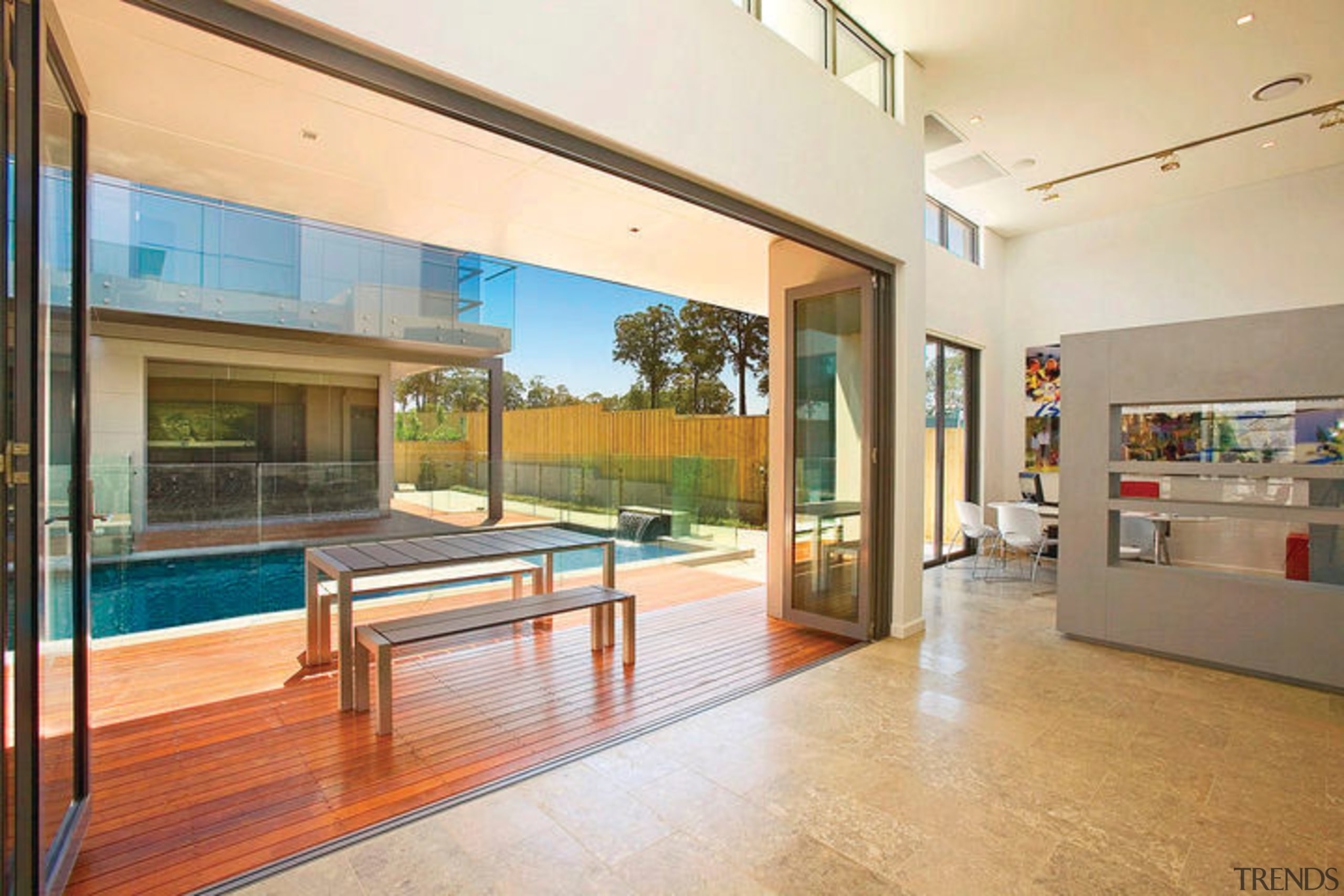 Interior view looking out to pool area of apartment, architecture, condominium, daylighting, door, estate, floor, flooring, home, house, interior design, living room, lobby, property, real estate, window, white, orange