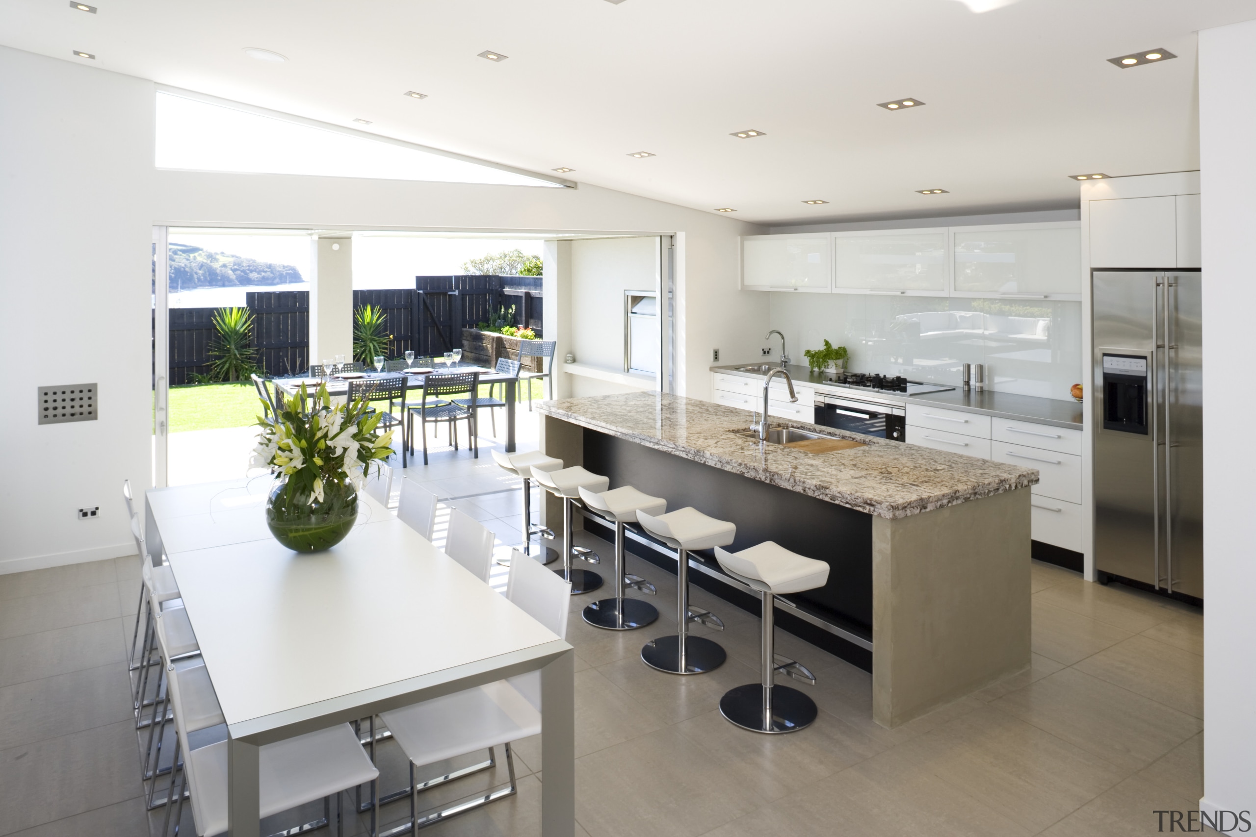 A view of the kitchen and dining areas, countertop, interior design, kitchen, real estate, white