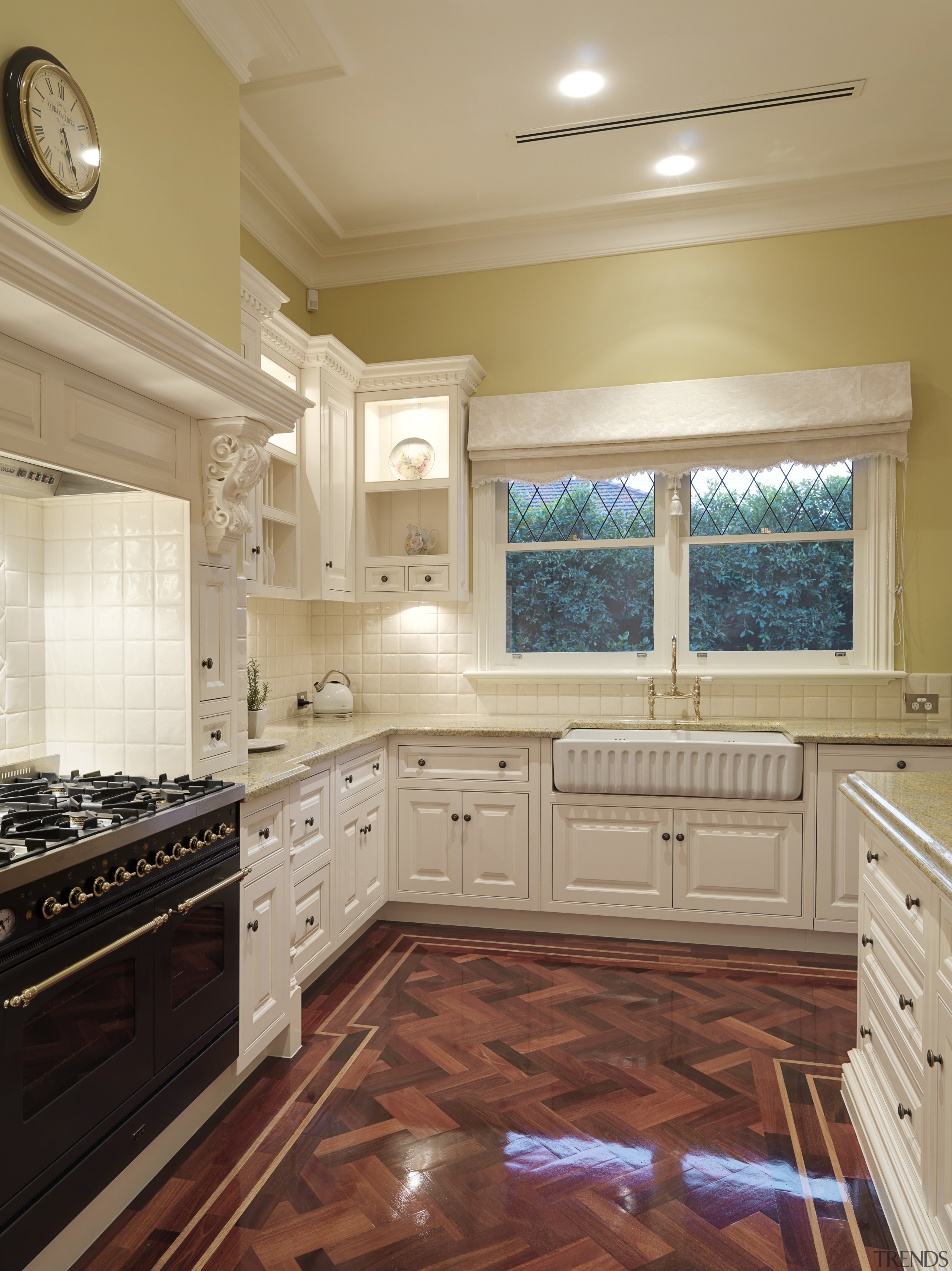 View of traditional styled kitchen in a new cabinetry, ceiling, countertop, cuisine classique, floor, flooring, hardwood, home, interior design, kitchen, room, tile, under cabinet lighting, window, wood flooring, orange
