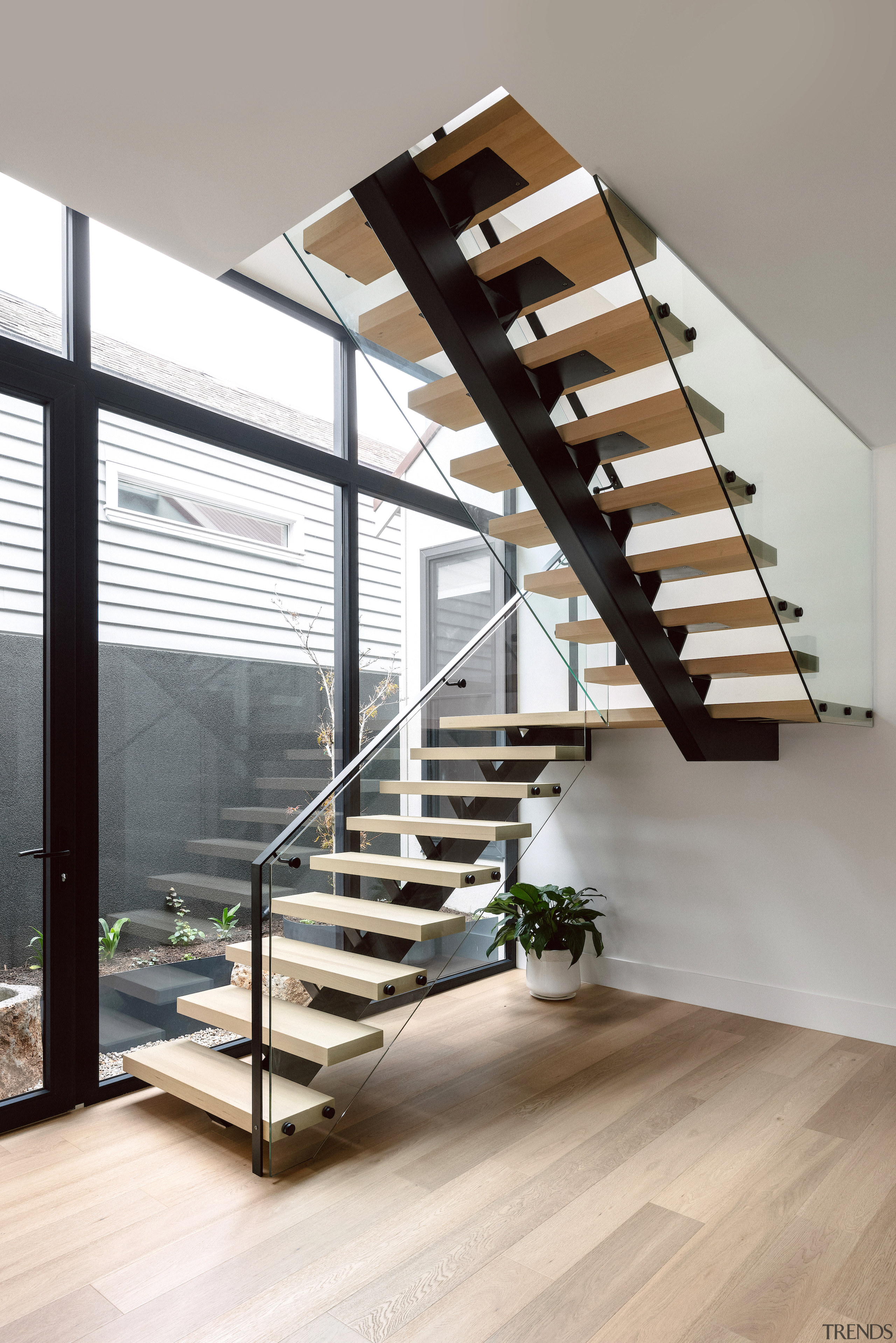Elegant circulation – the riserless stairs have wooden 