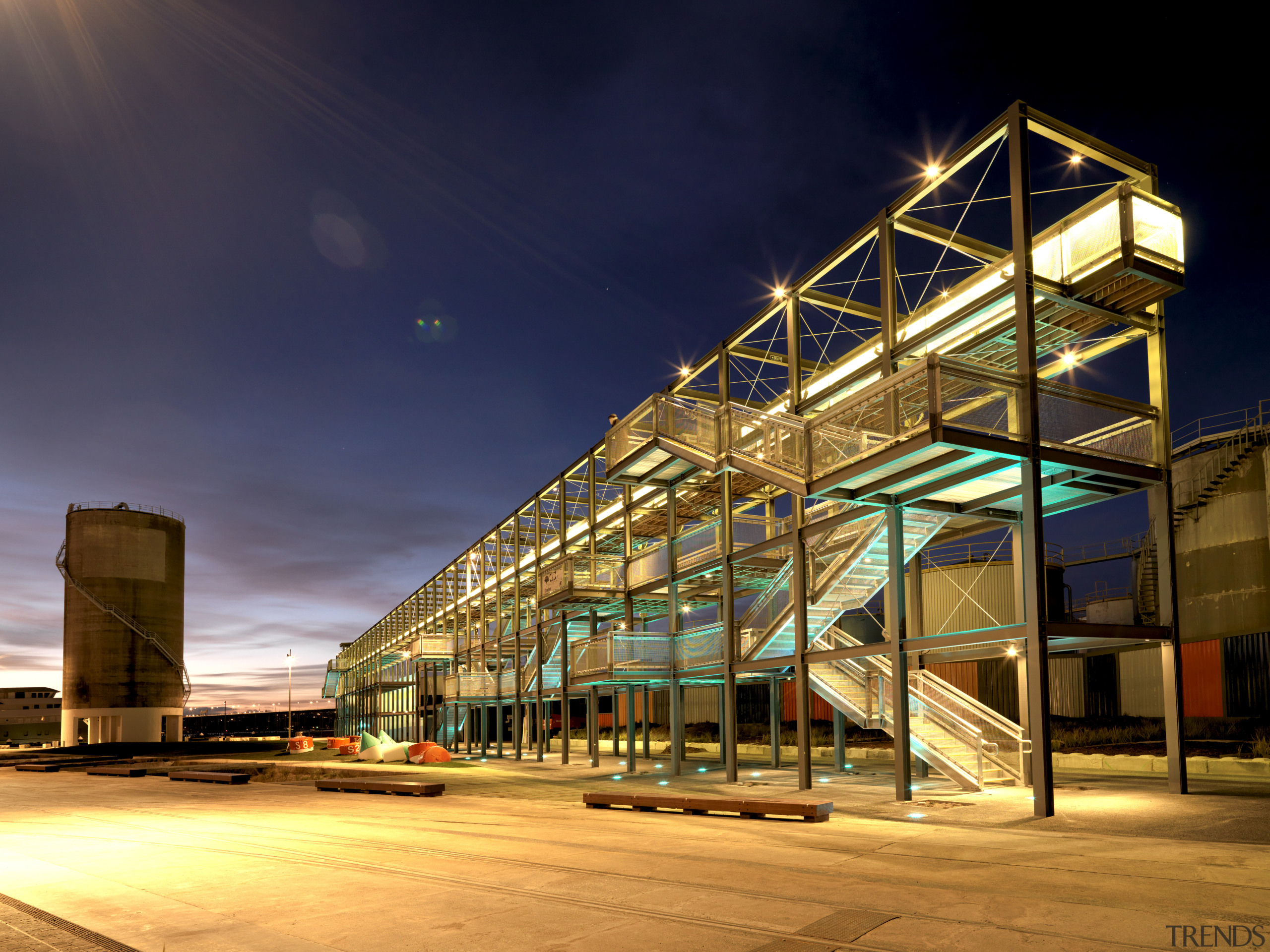 Exterior of watefront building at night. - Exterior architecture, building, city, commercial building, condominium, evening, facade, landmark, light, lighting, metropolis, metropolitan area, mixed use, night, reflection, residential area, sky, structure, urban area