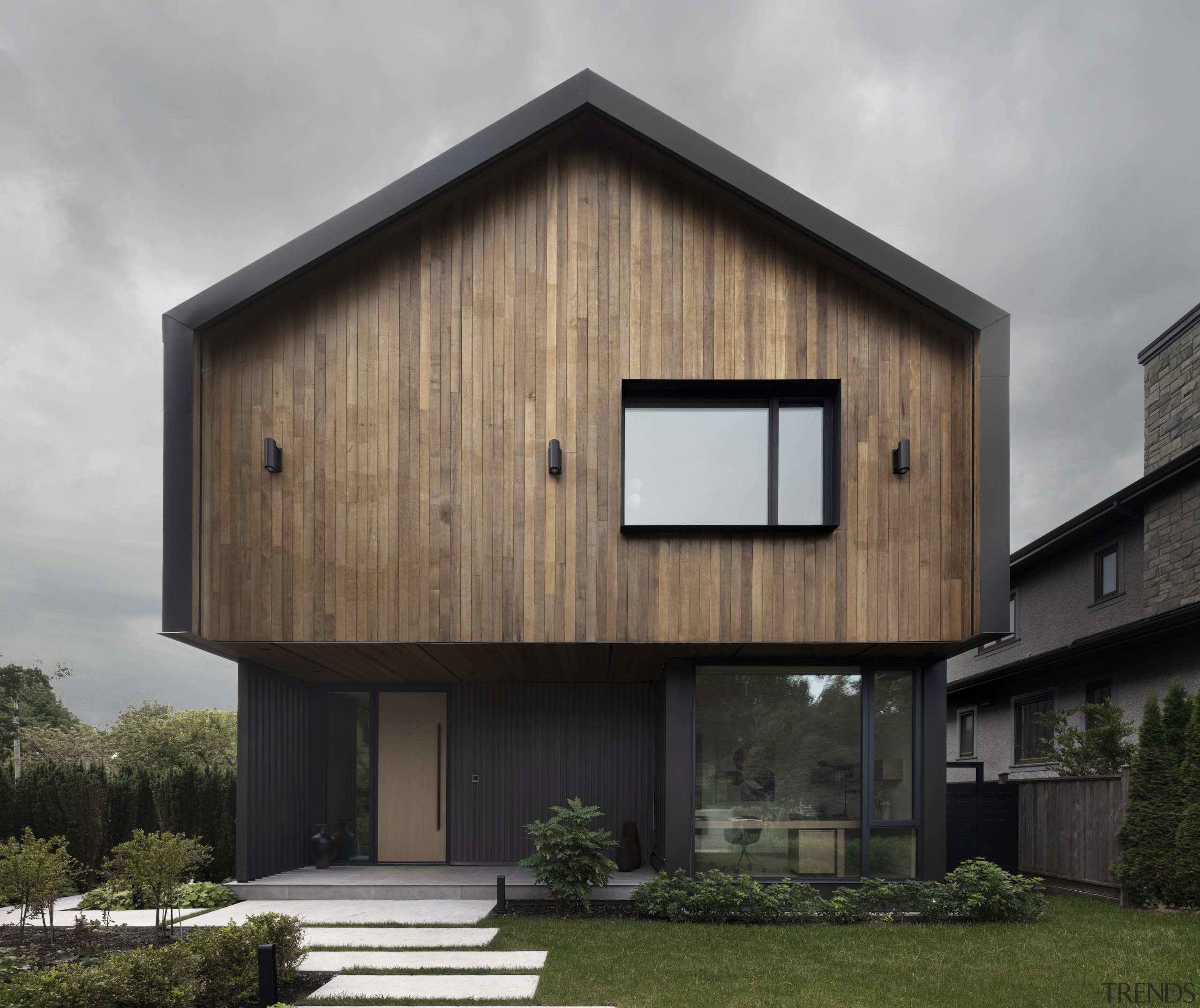 A prominent gable form floats atop the main 