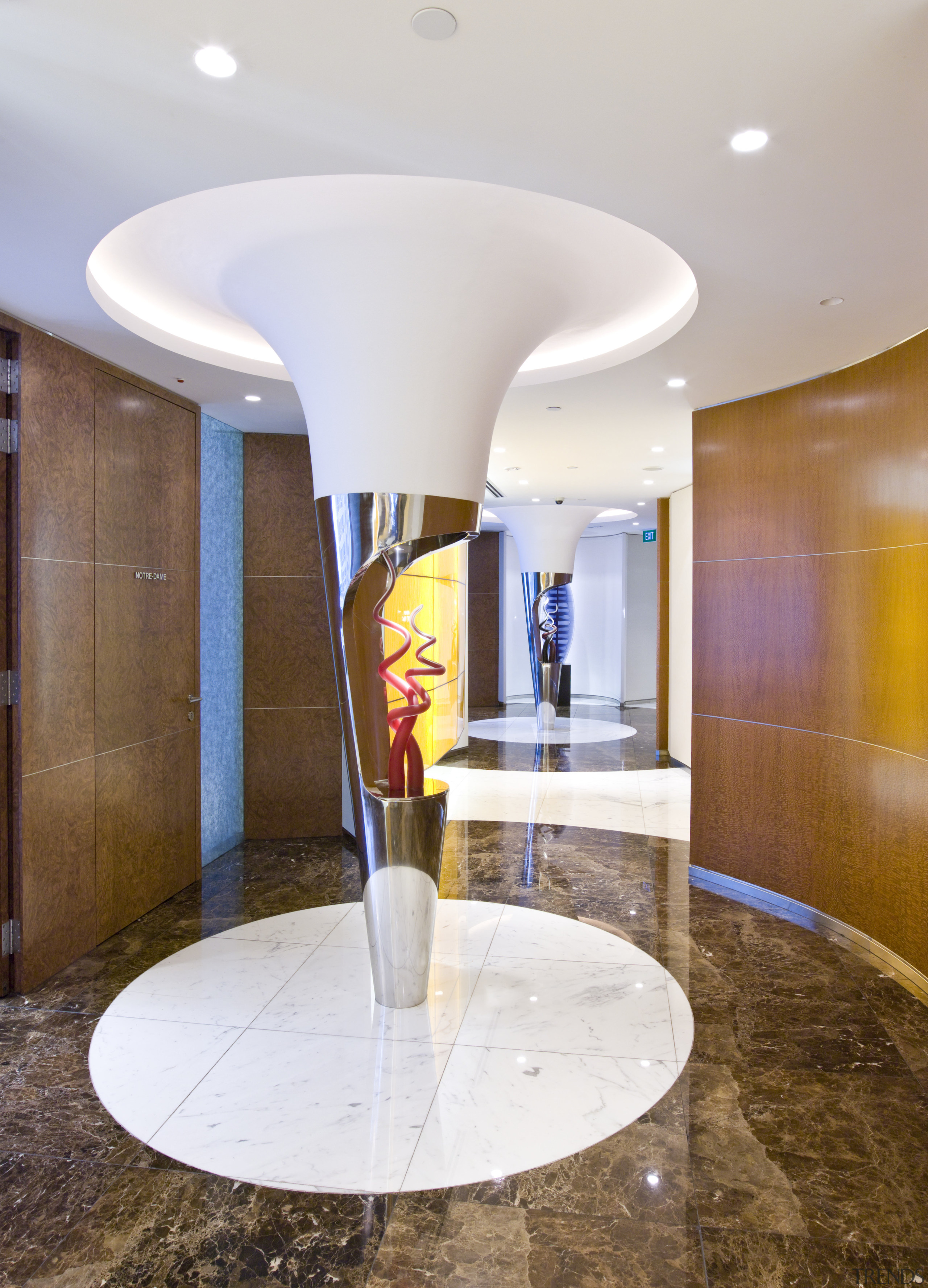 View of a sculpture in the corridor with ceiling, floor, flooring, interior design, lobby, real estate, table, white, brown