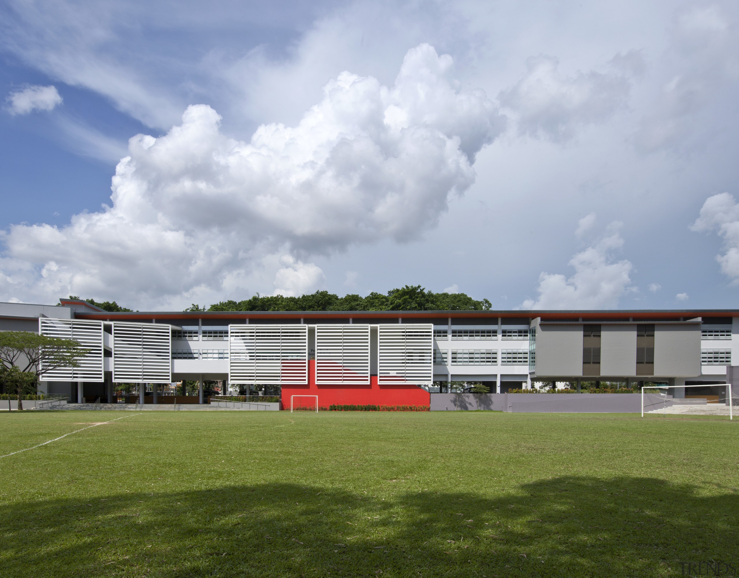 Exterior view from the fields - Exterior view architecture, campus, cloud, corporate headquarters, facade, grass, house, real estate, sky, sport venue, stadium, structure, gray