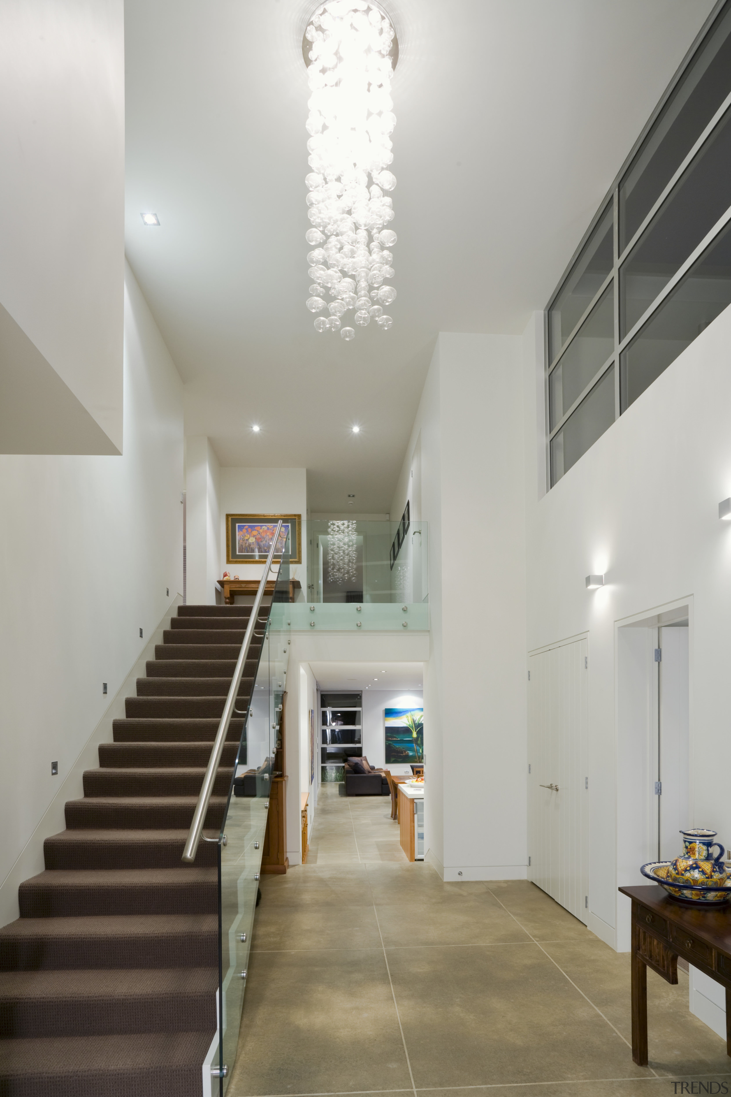 Town &amp; Country Residential oversees all elements of architecture, ceiling, daylighting, floor, flooring, handrail, home, house, interior design, lobby, real estate, stairs, gray