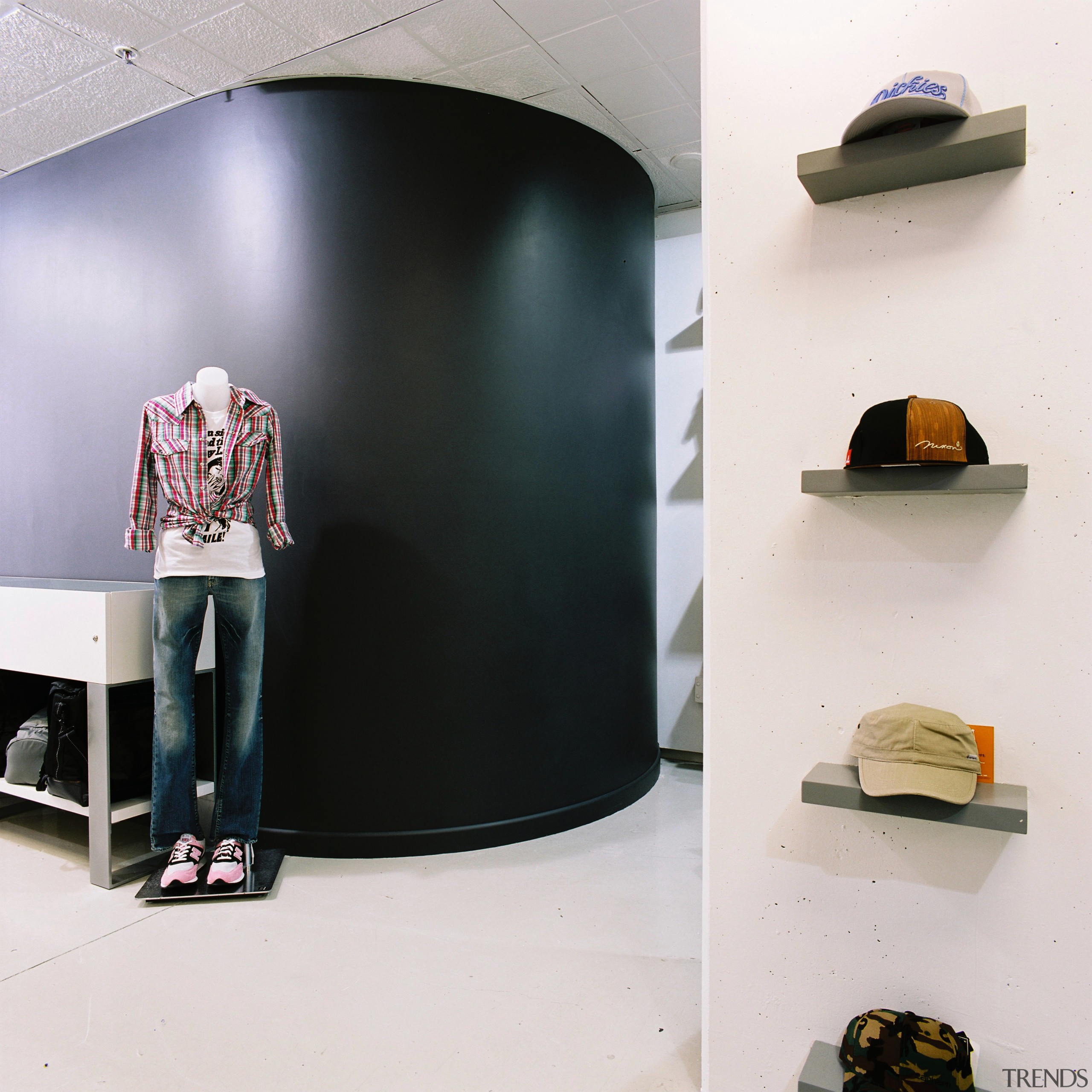 A view of the curved plasterboard walls installed furniture, product design, shelf, shelving, shoe, white, black