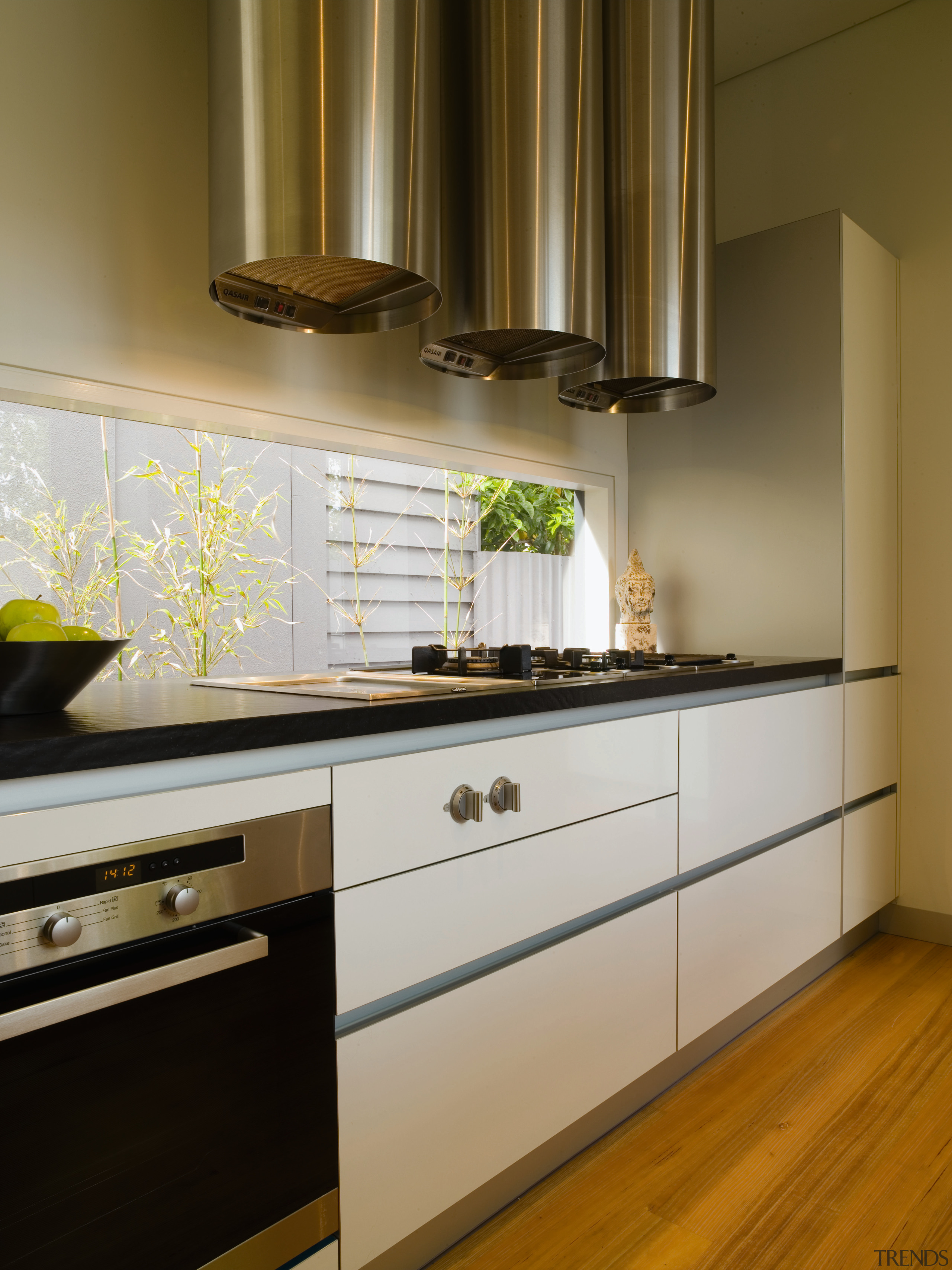 A view of the kitchen, wooden flooring and cabinetry, countertop, cuisine classique, floor, flooring, hardwood, interior design, kitchen, room, under cabinet lighting, brown