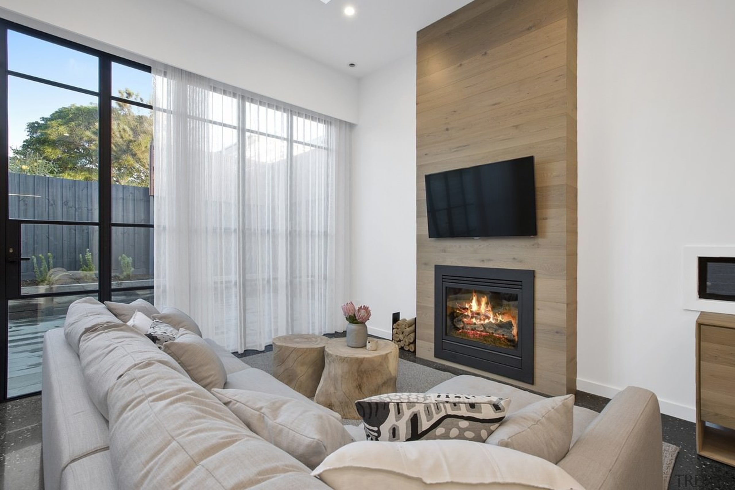 A closer view of the fireplace and TV fireplace, floor, hearth, interior design, living room, property, real estate, window, gray