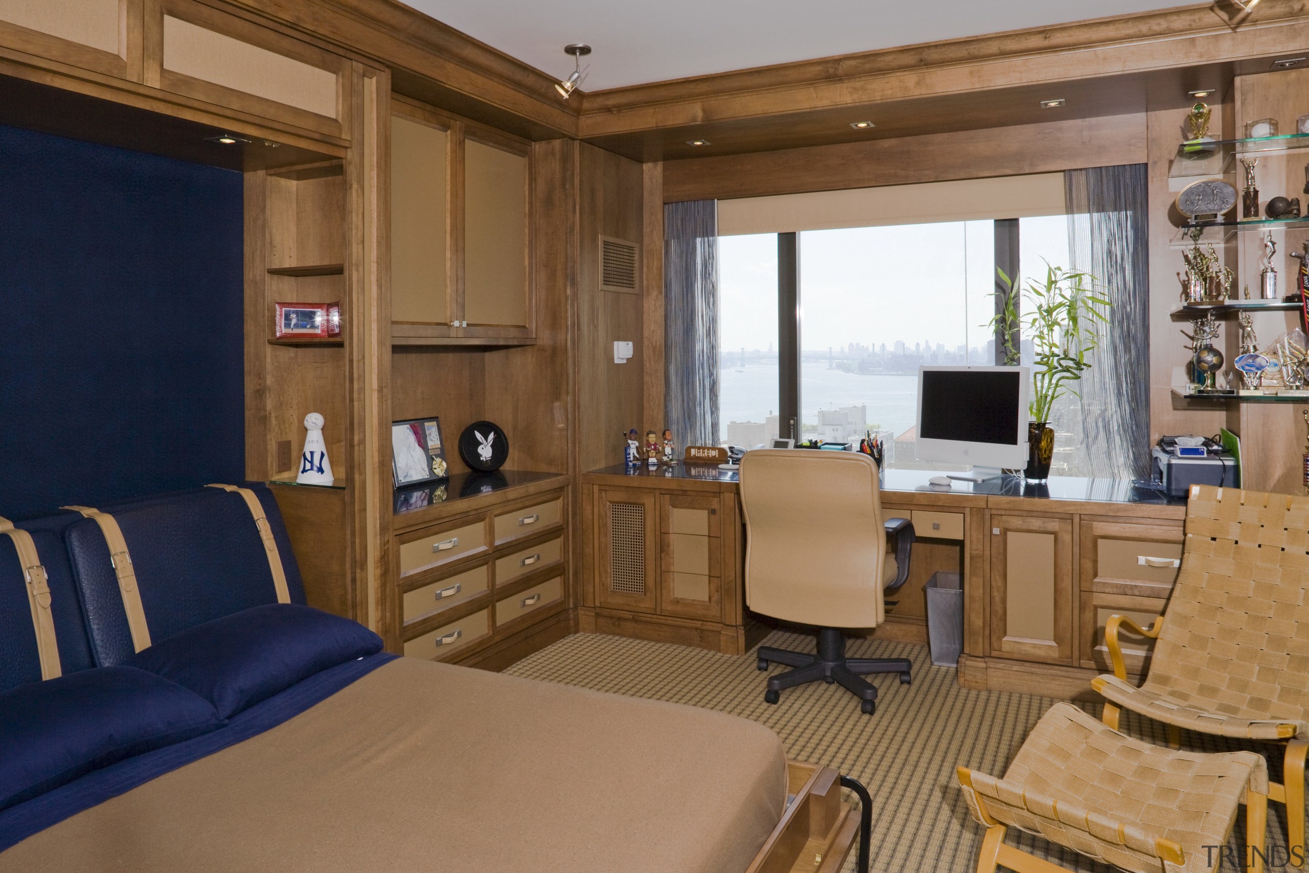 View of a bedroom featuring carpeted flooring, wooden interior design, real estate, room, suite, brown