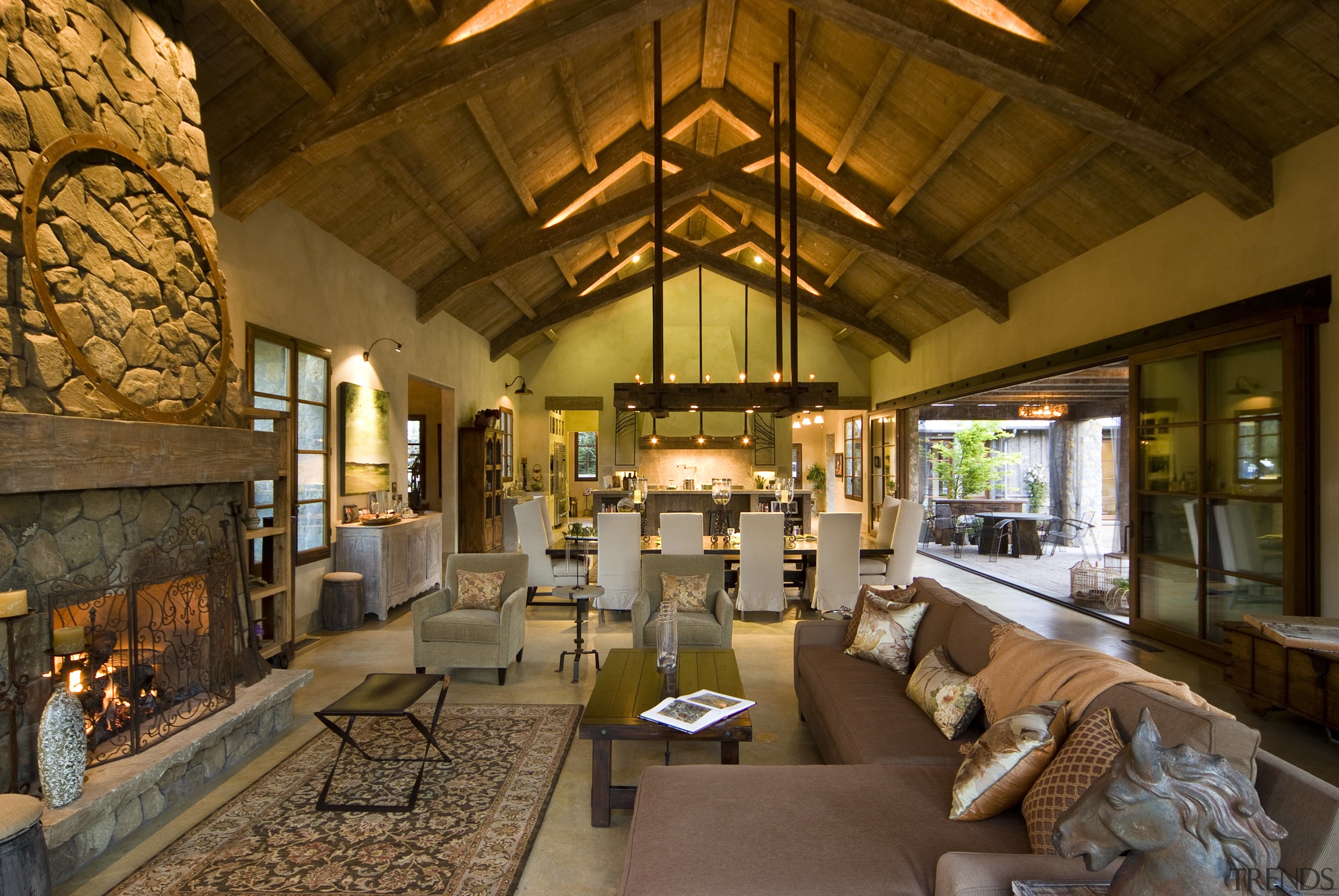 Rustic house modelled on French barn. Interiors feature home, interior design, living room, lobby, room, brown
