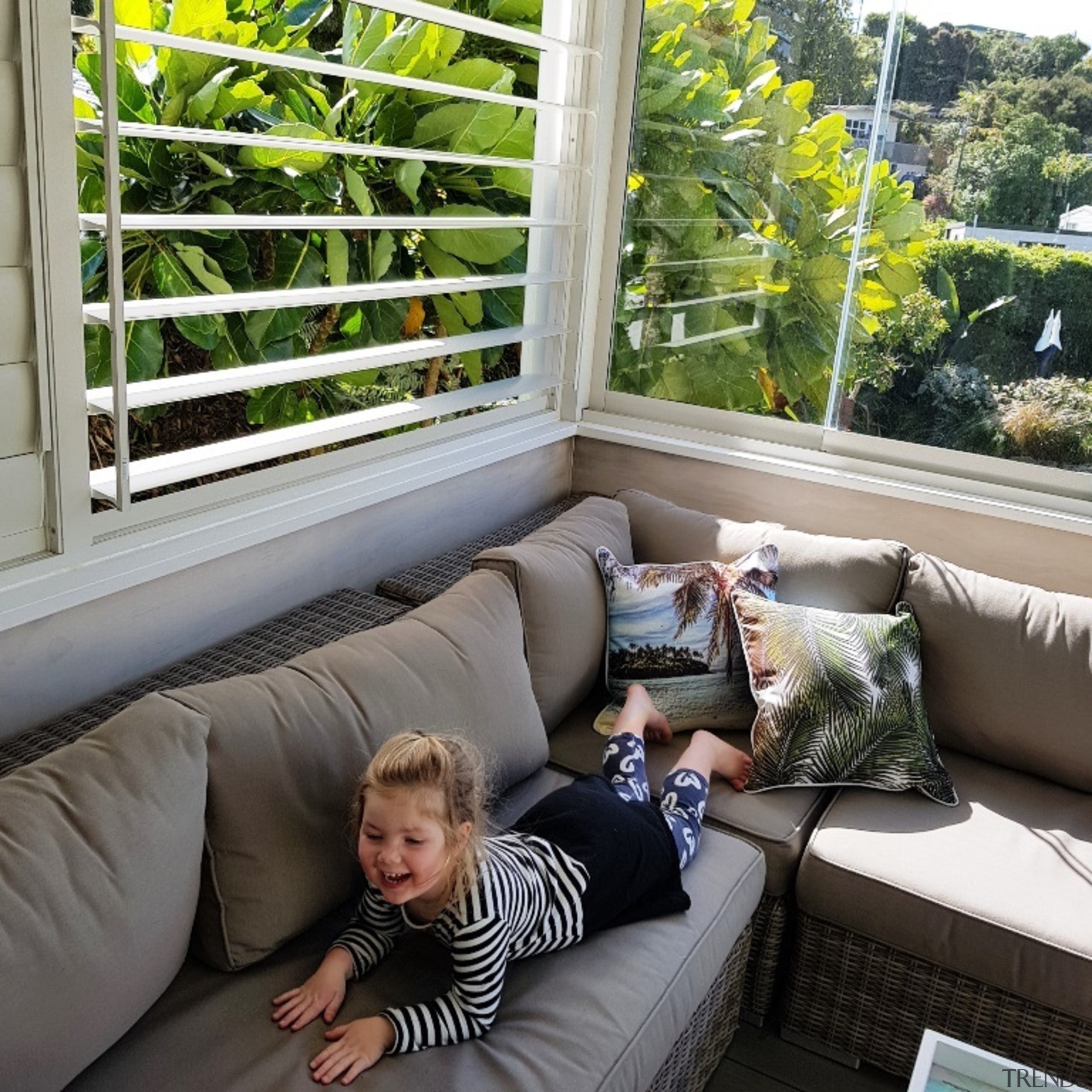 The creation of an outdoor room ensured more building, comfort, couch, furniture, home, house, interior design, leisure, living room, porch, property, real estate, room, tree, window, gray